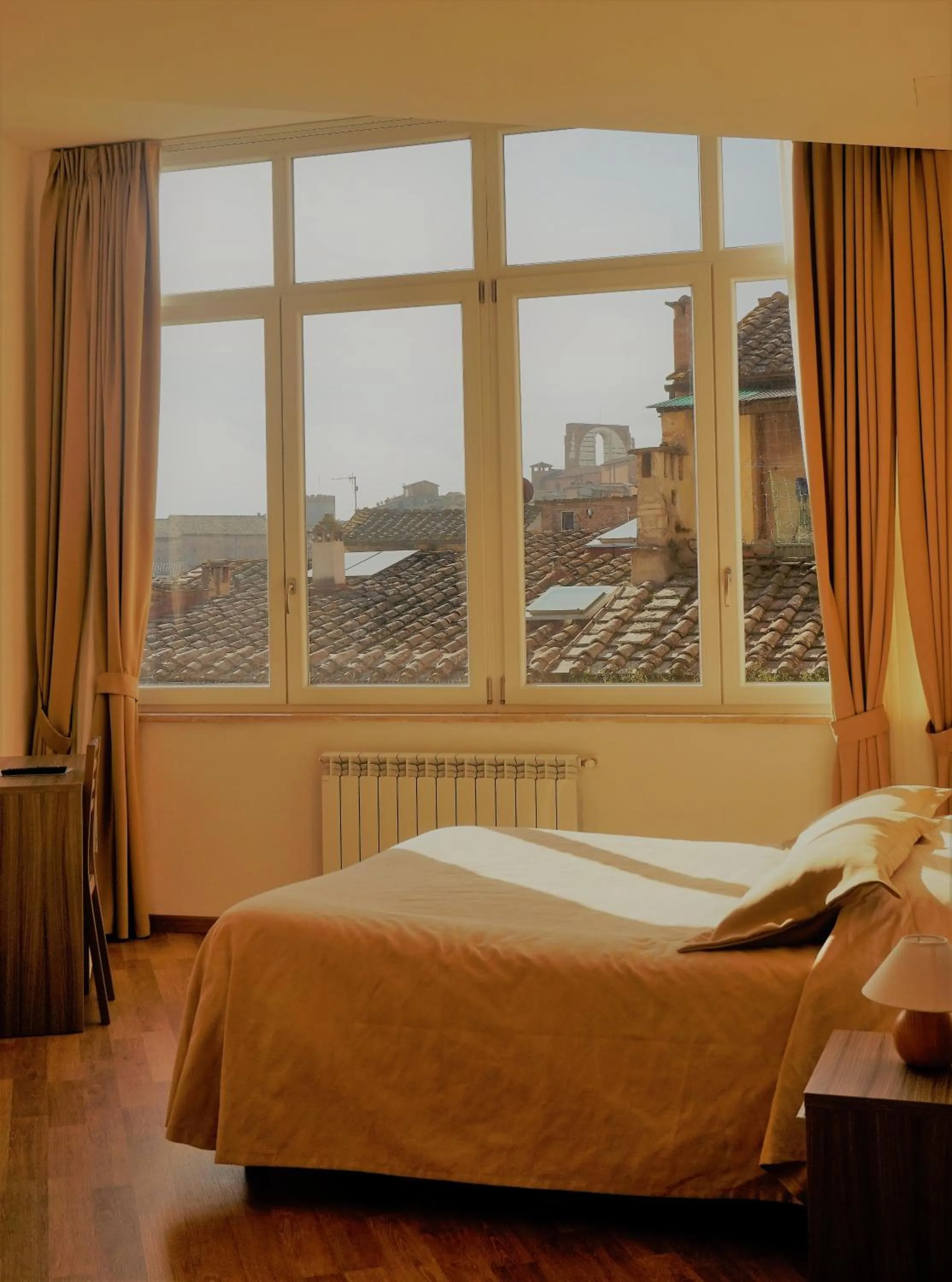 Bed in B&B I Tetti di Siena