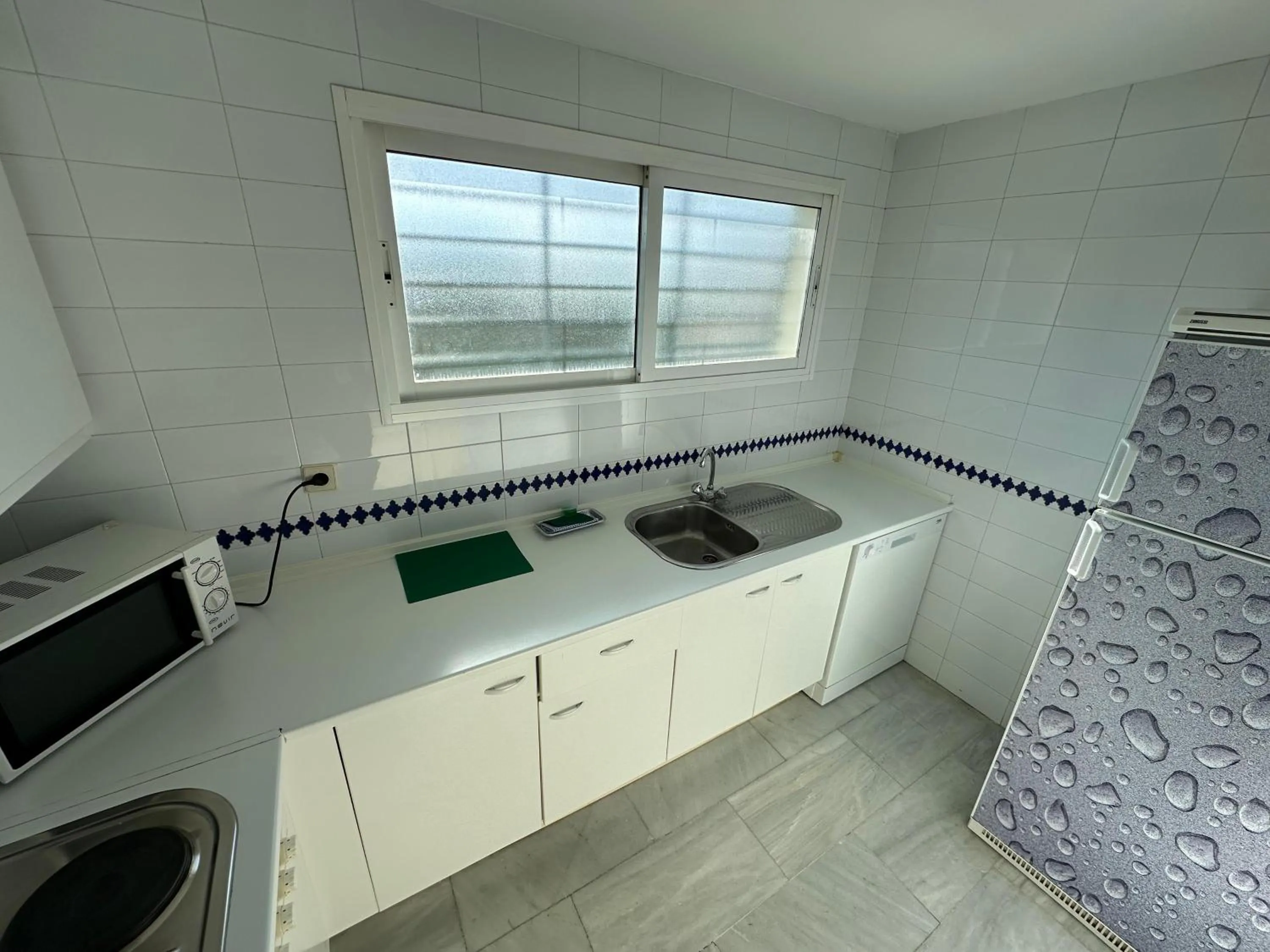 Kitchen or kitchenette in Hospedium Hotel Apartamentos Simón Verde