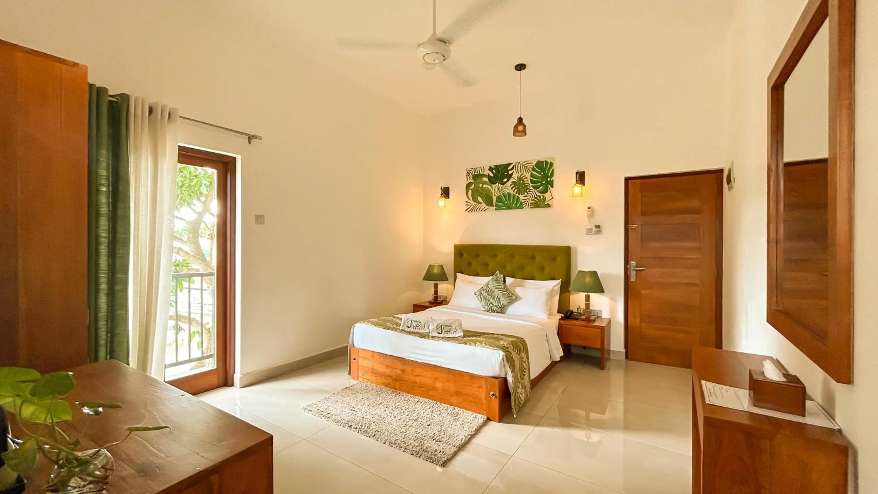 Bed in J leaf Hotel by Blue Bird