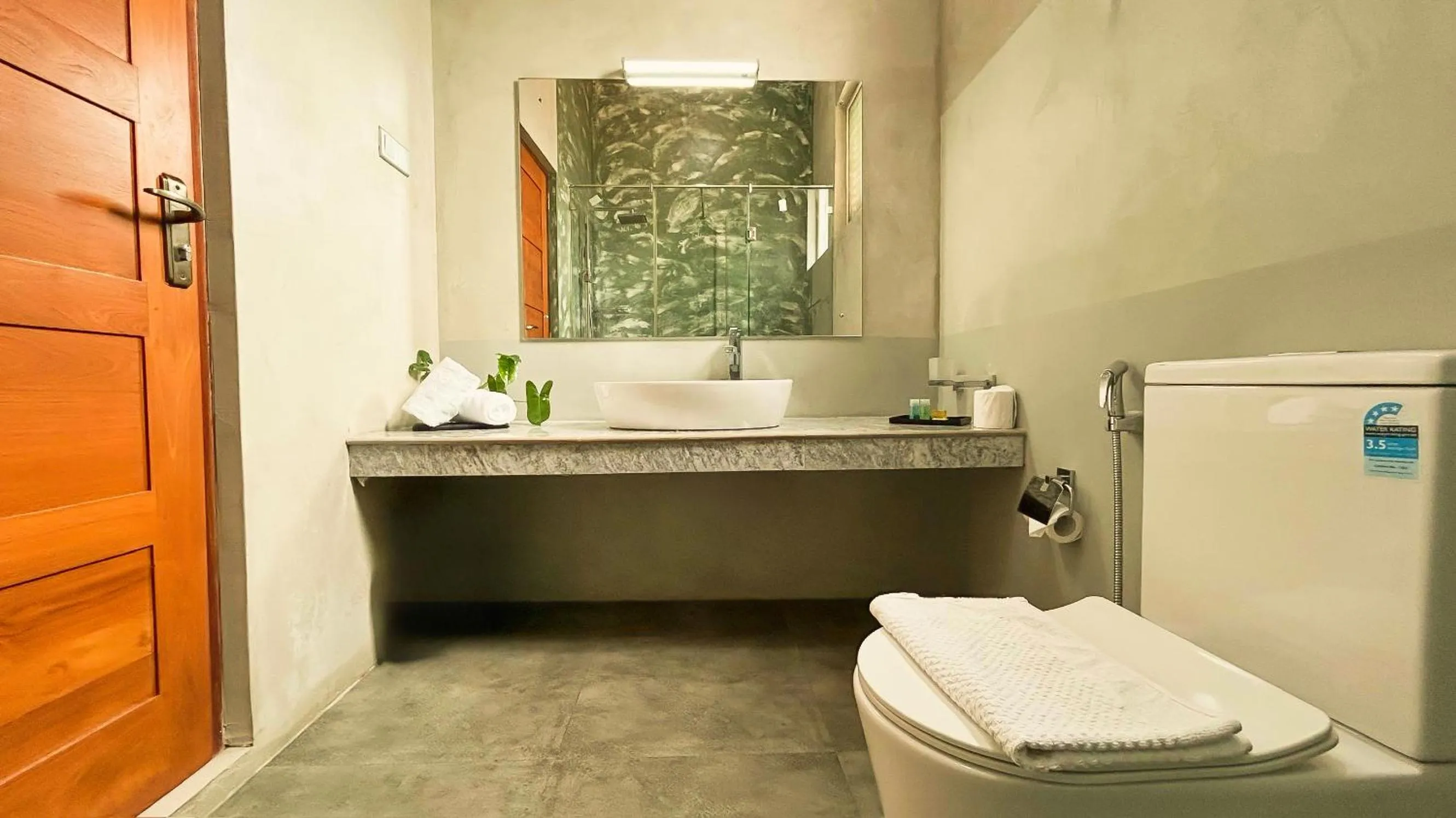 Toilet in J leaf Hotel by Blue Bird