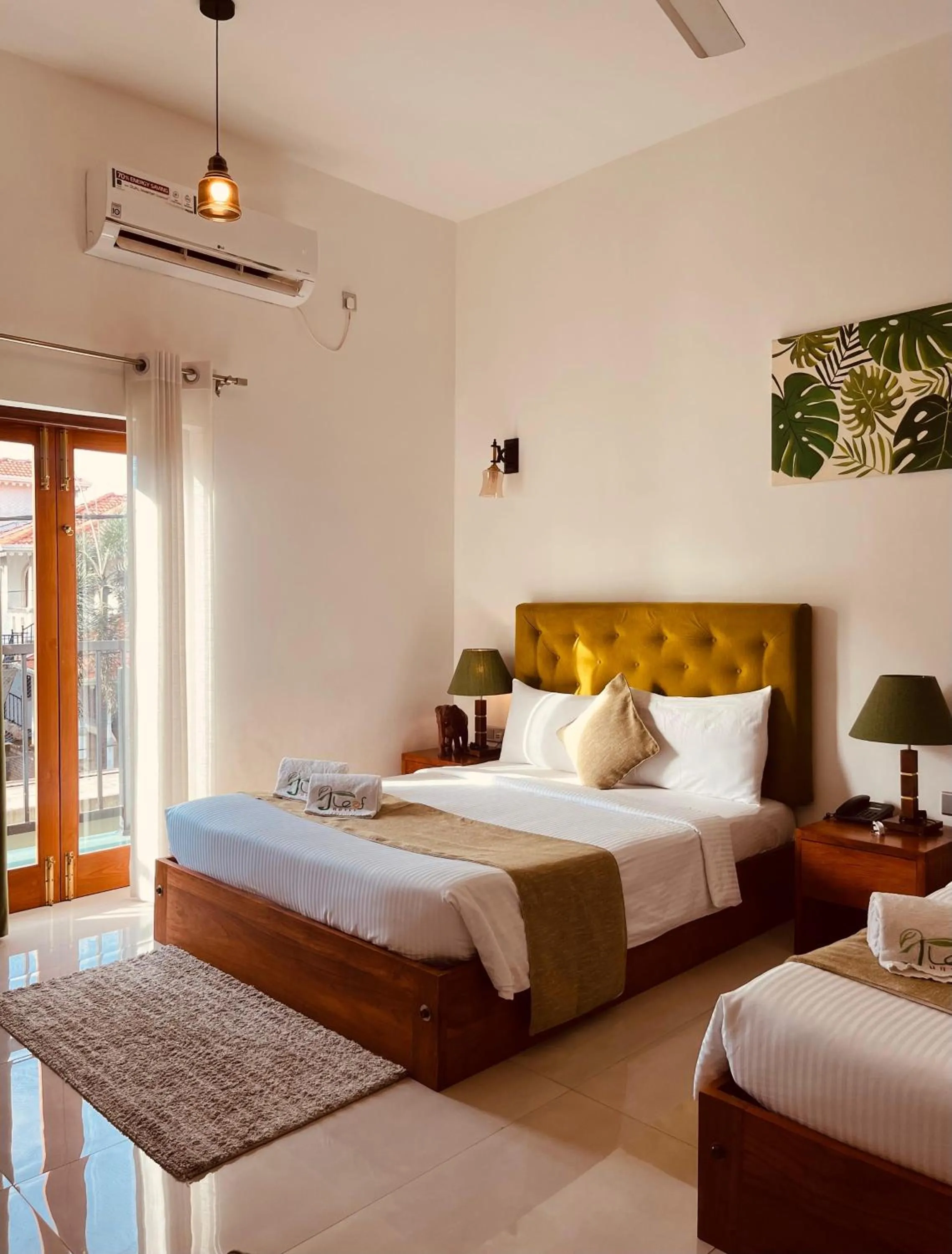 Bed in J leaf Hotel by Blue Bird