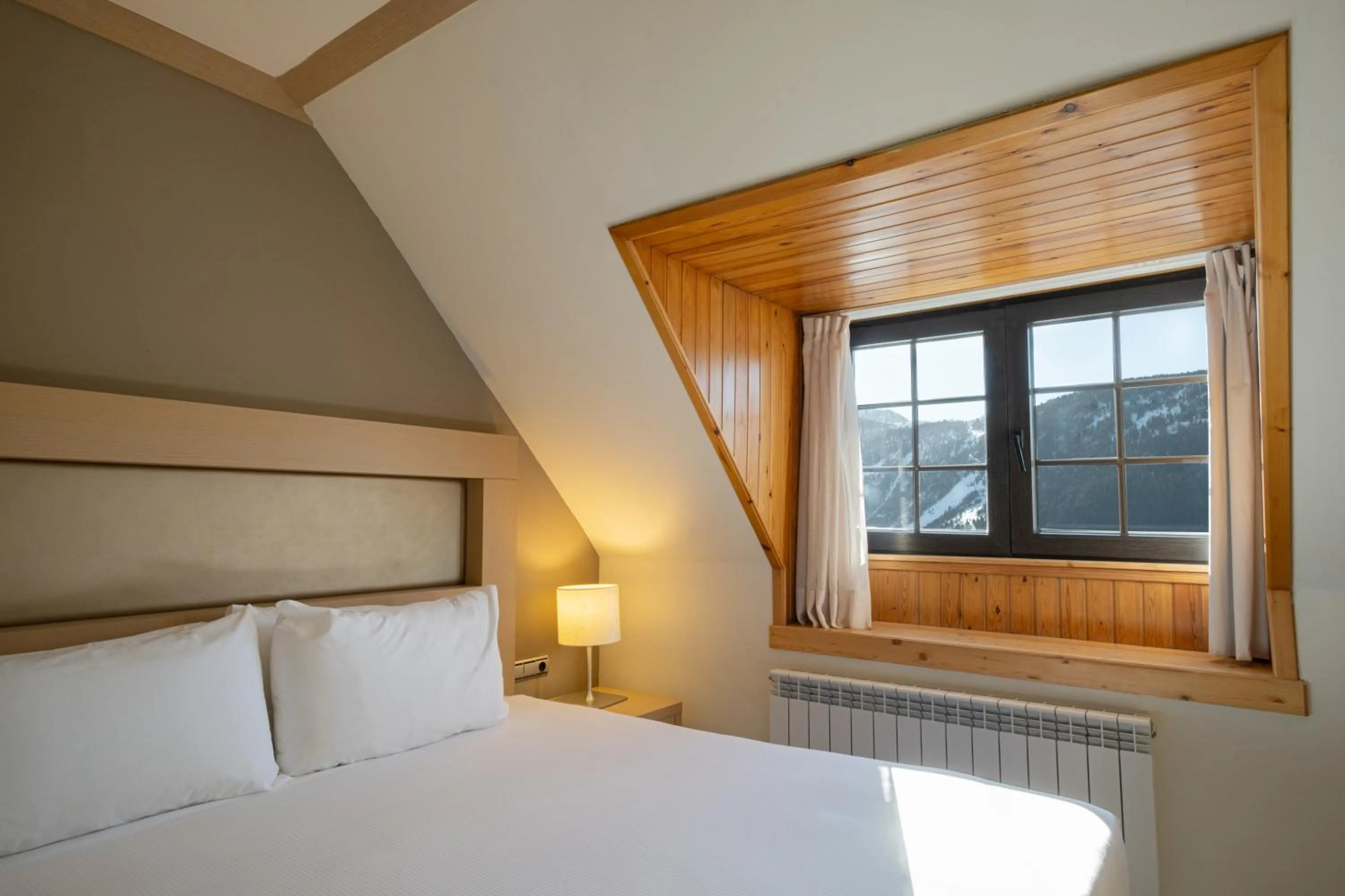 Bed in Eurostars Royal Tanau