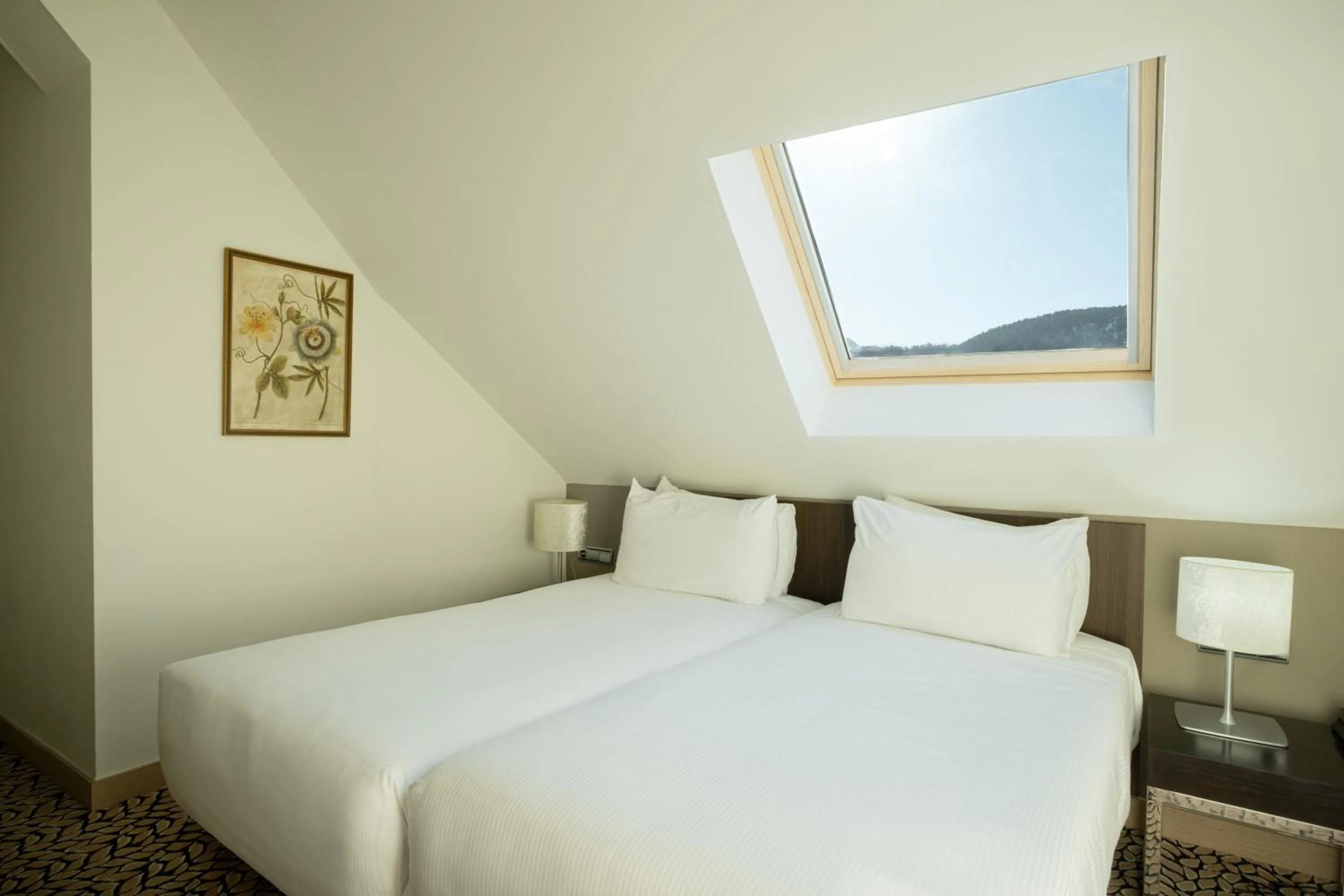 Bed in Eurostars Royal Tanau