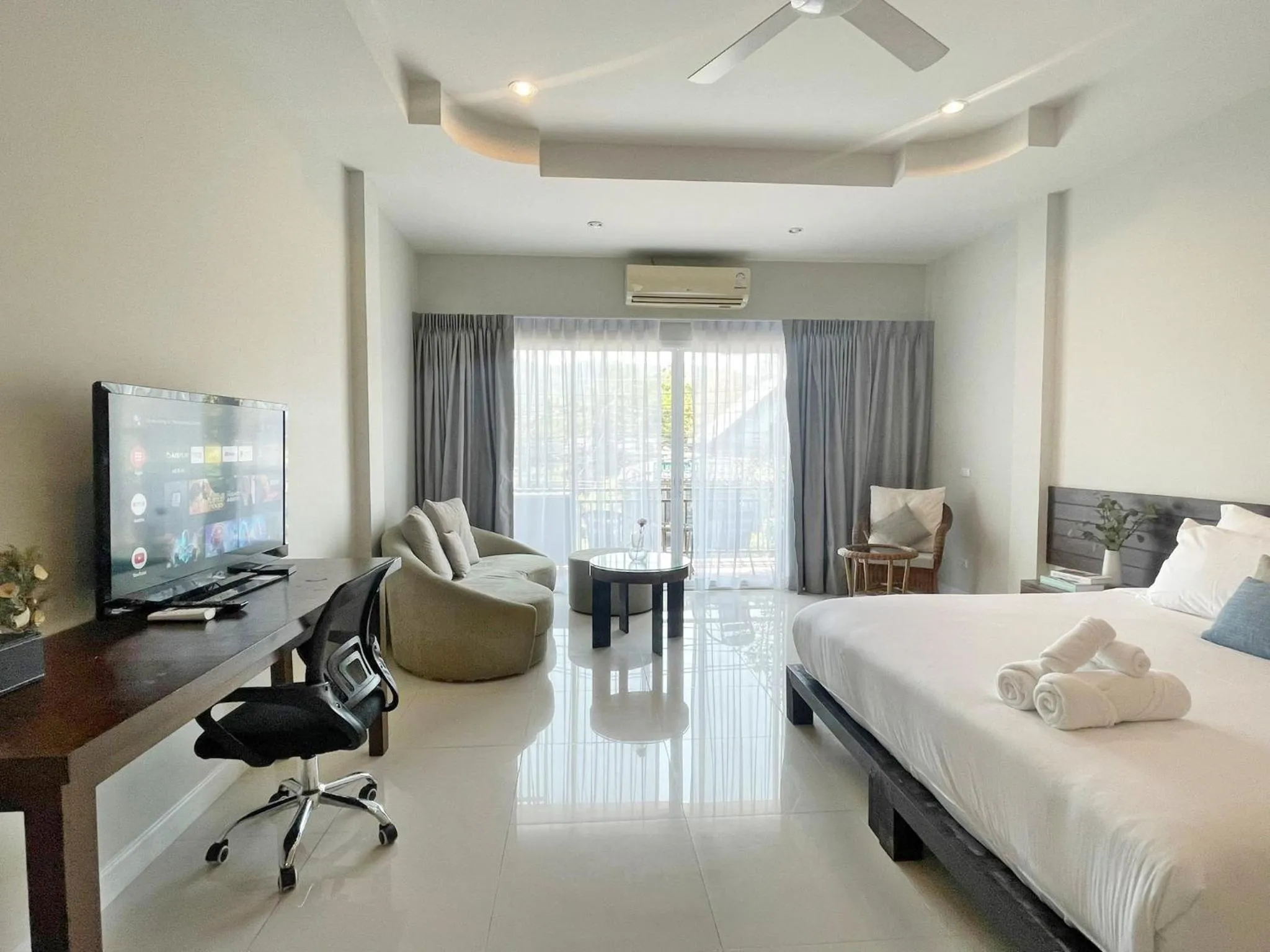 Bed in The Langstan Suites