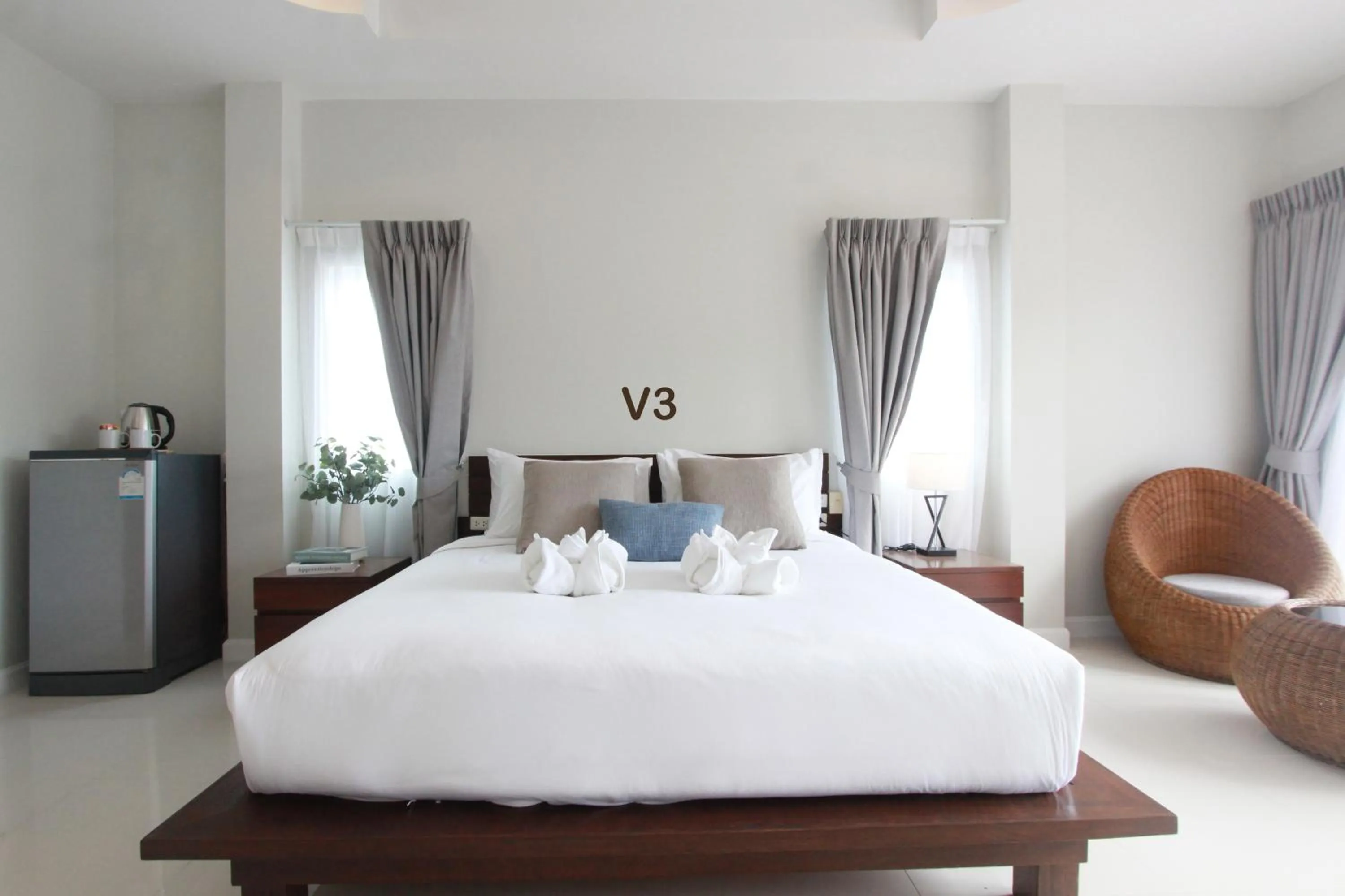 Bed in The Langstan Suites