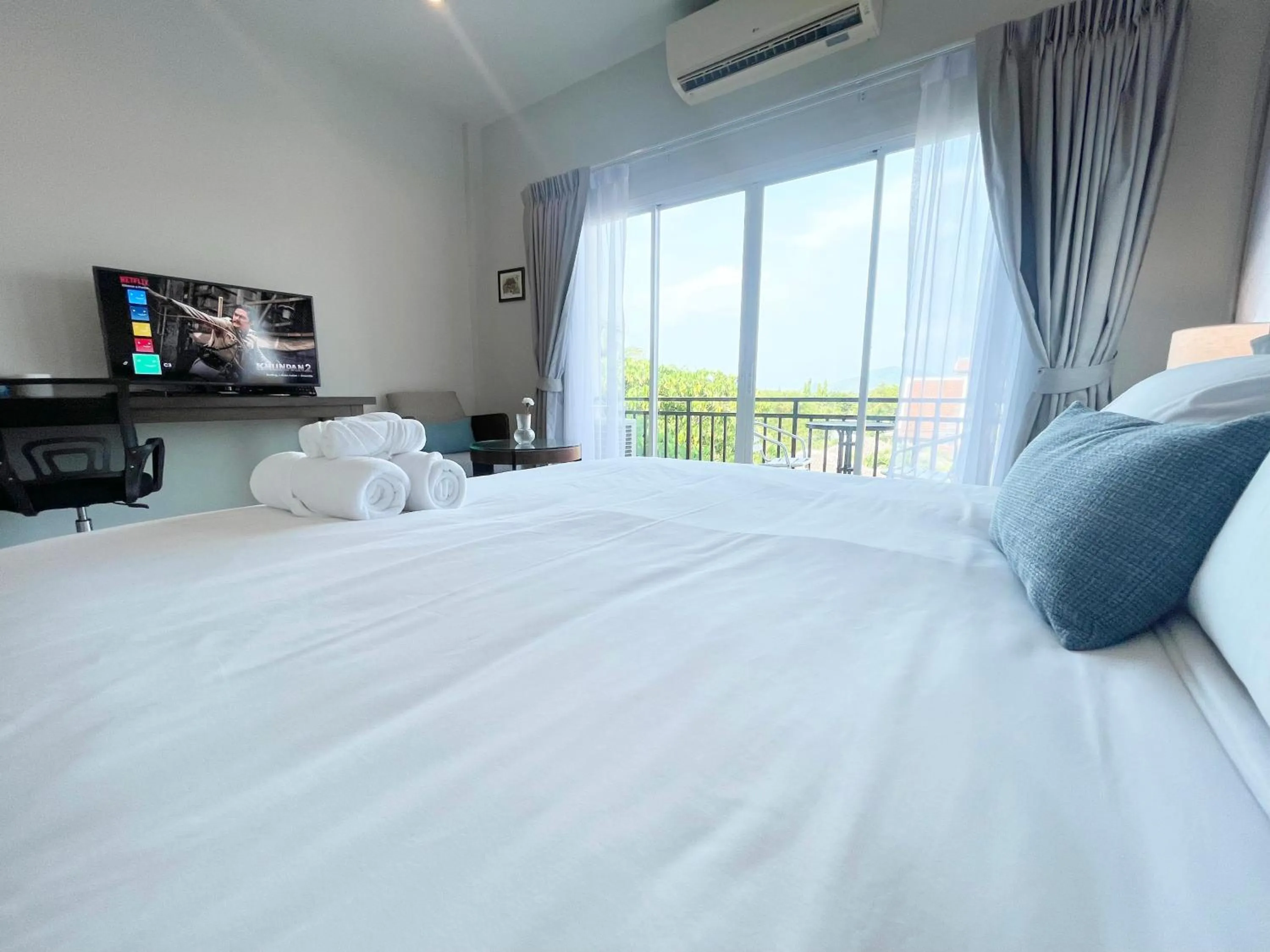 Bed in The Langstan Suites