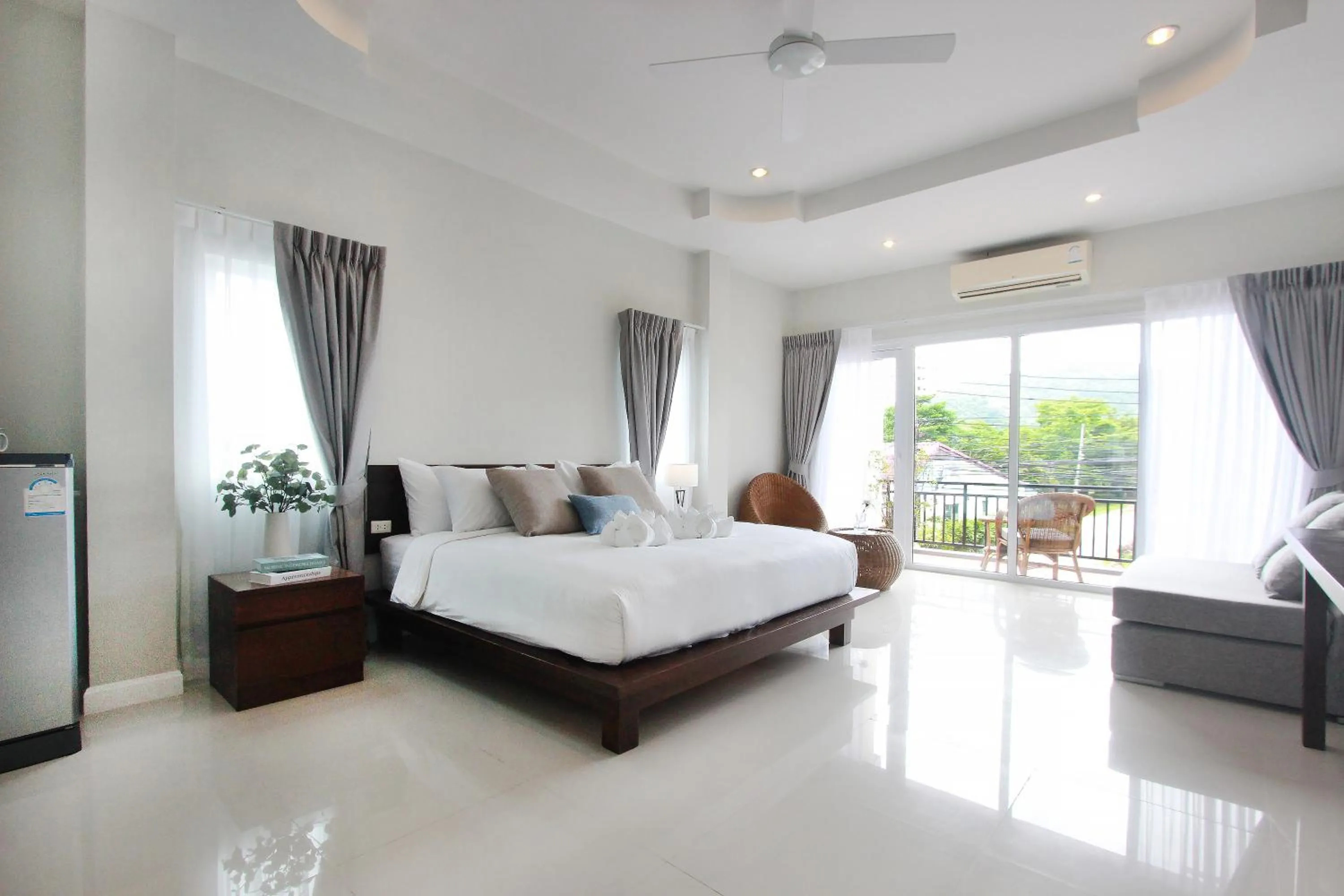 Bed in The Langstan Suites