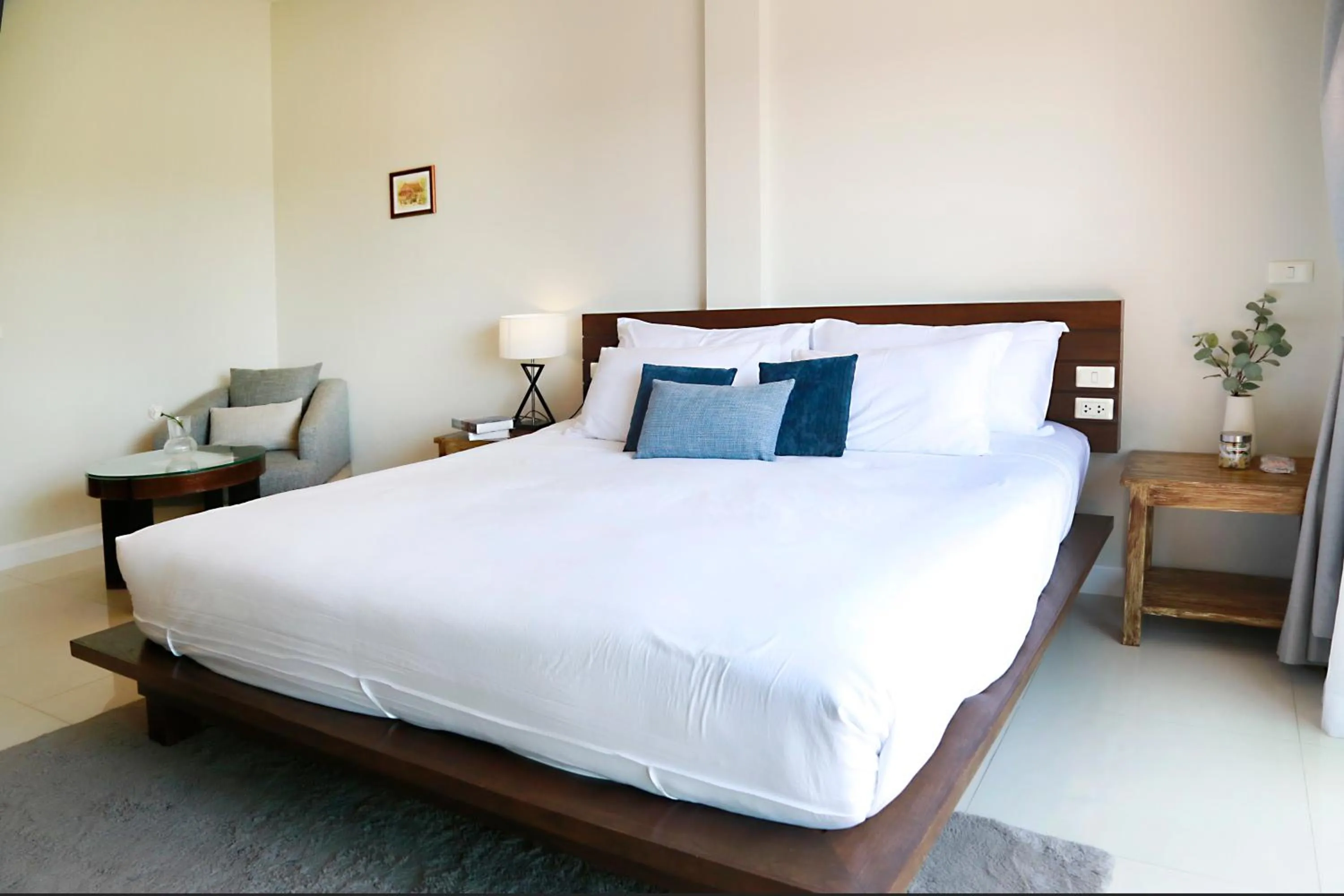 Bed in The Langstan Suites