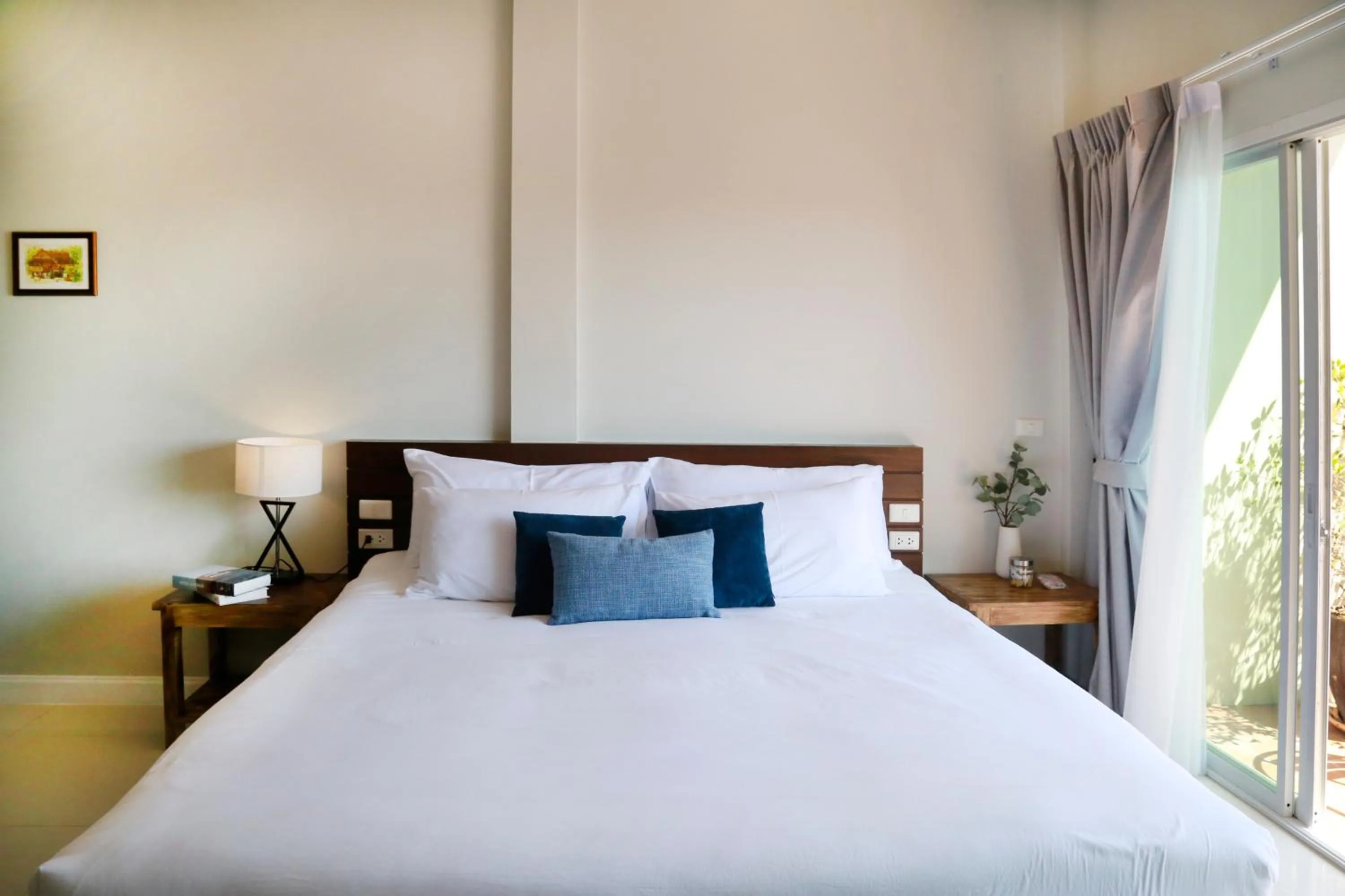 Bed in The Langstan Suites