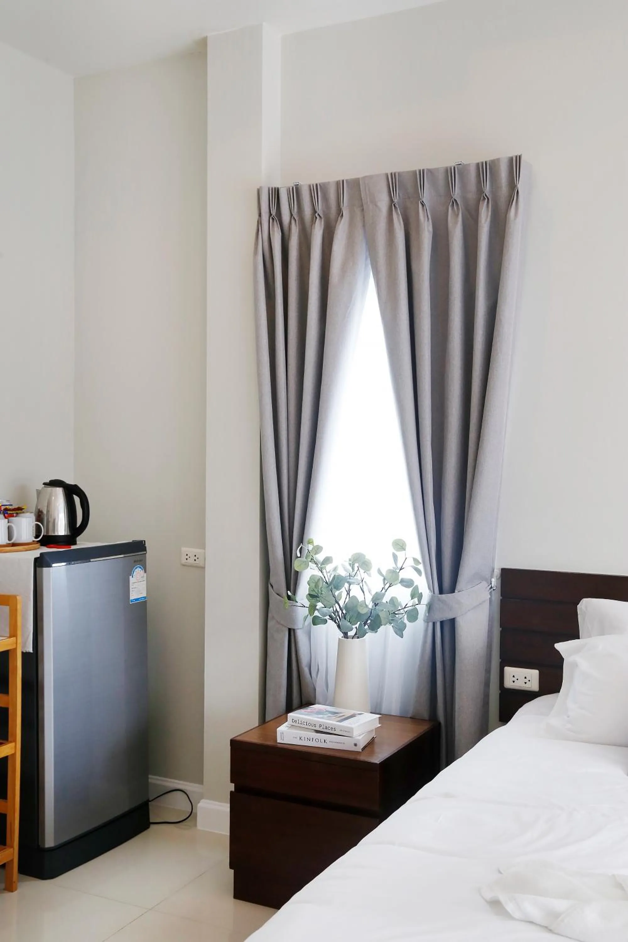 Bed in The Langstan Suites