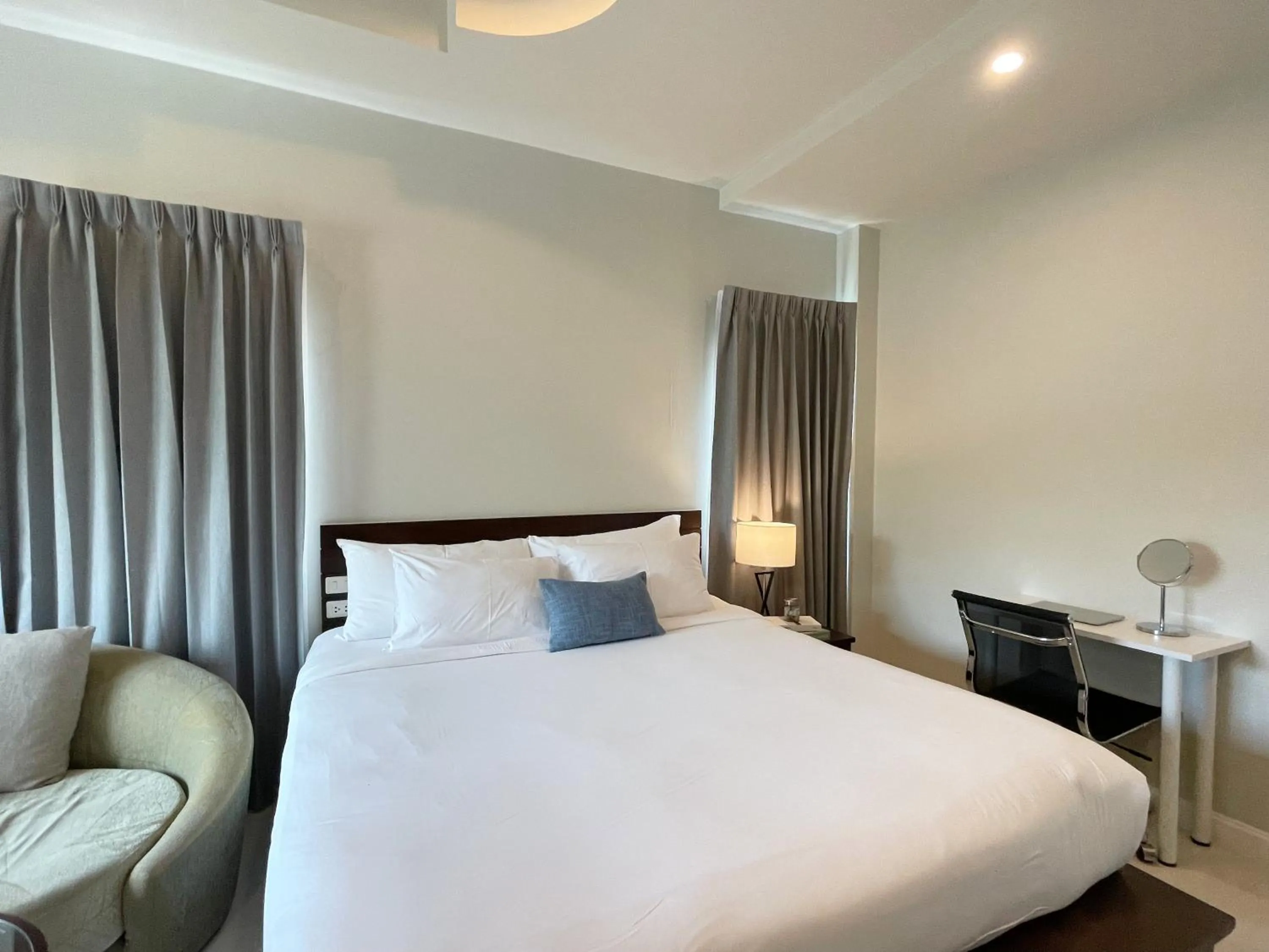 Bed in The Langstan Suites