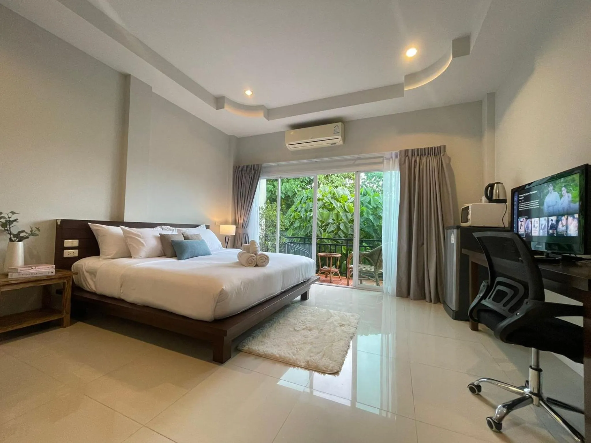Bed in The Langstan Suites