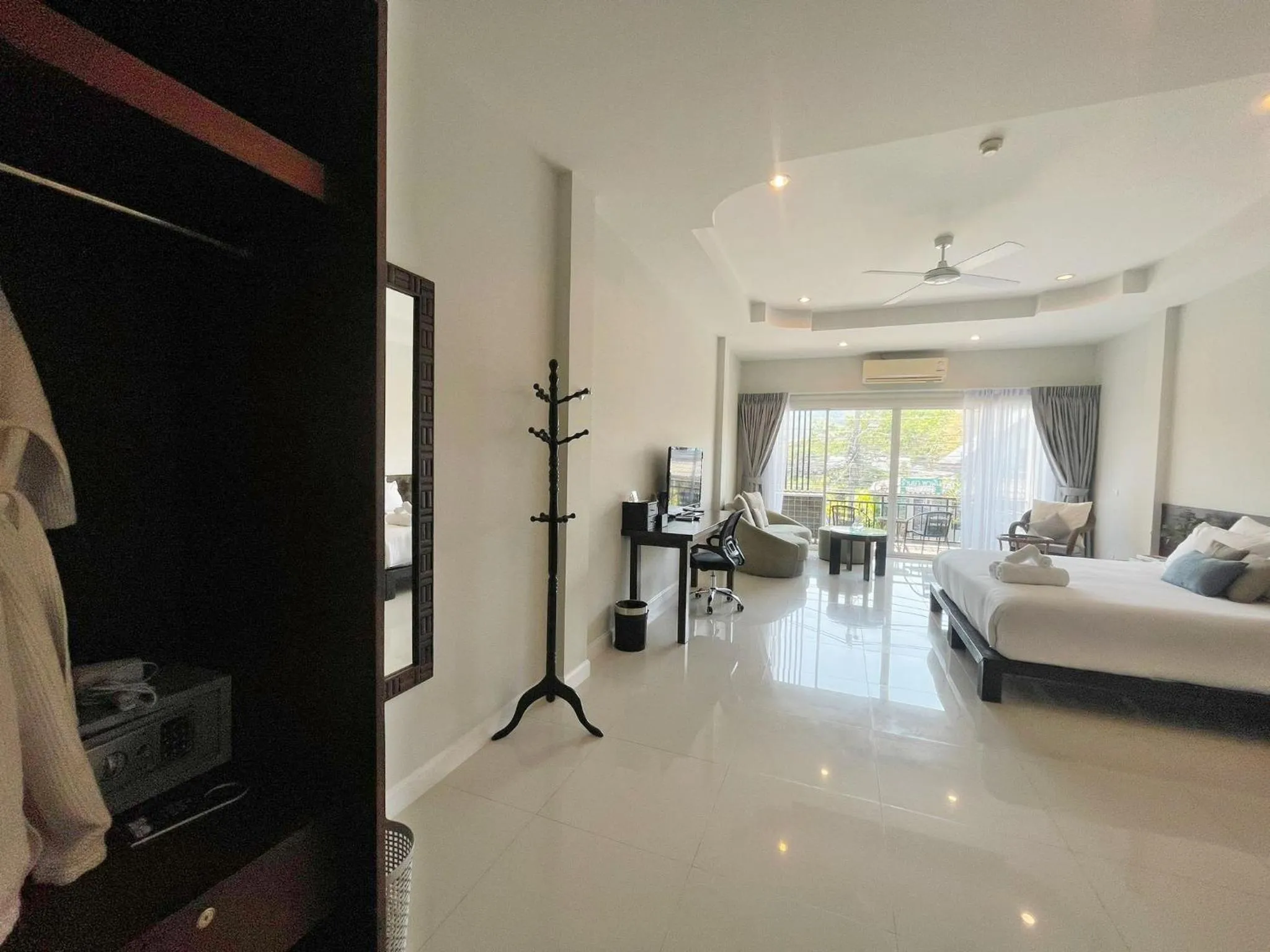 Bed in The Langstan Suites