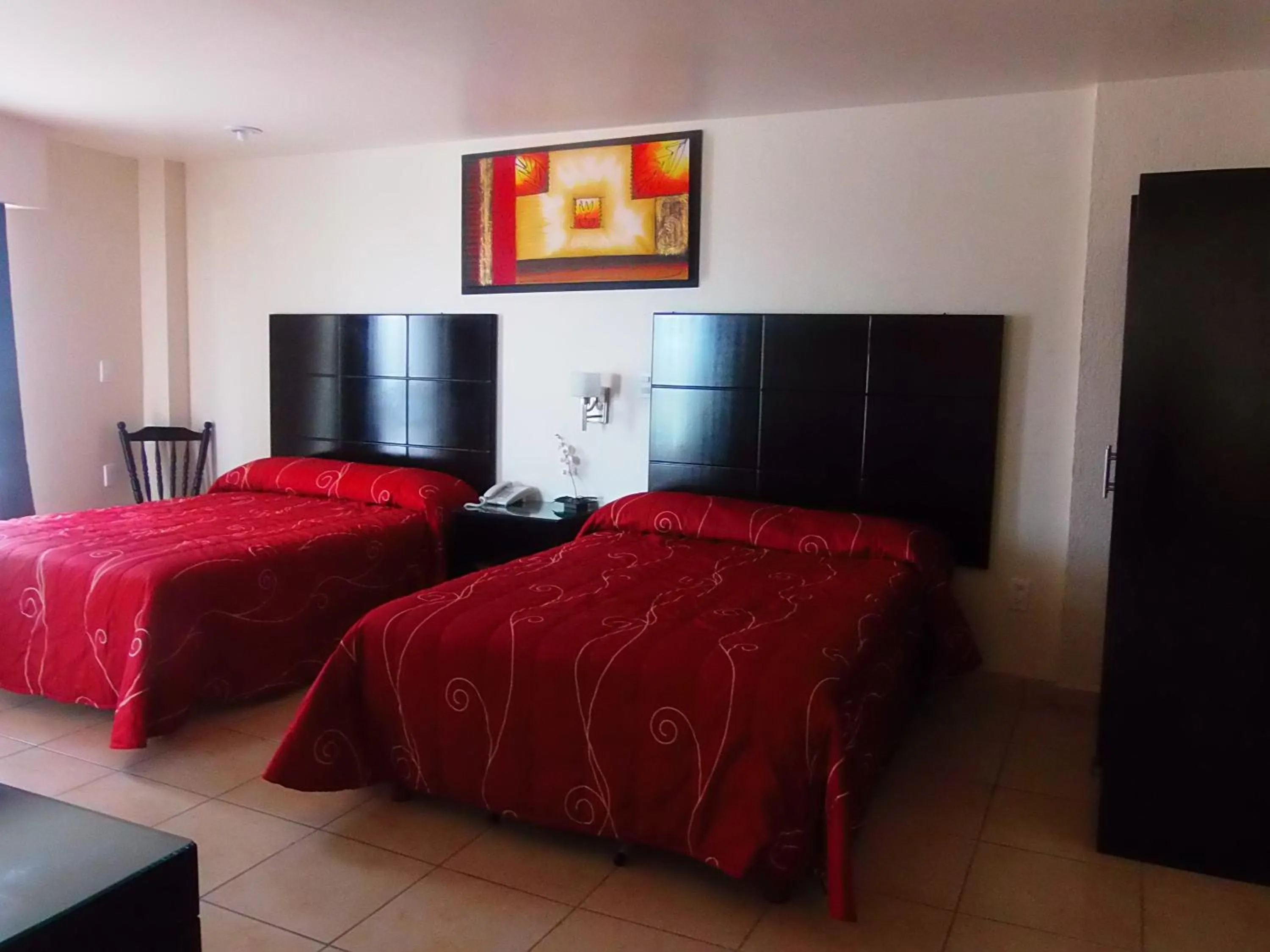 Bedroom in Hotel Raldos Inn