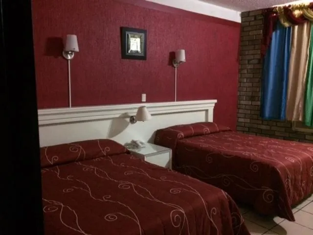 Bedroom in Hotel Raldos Inn