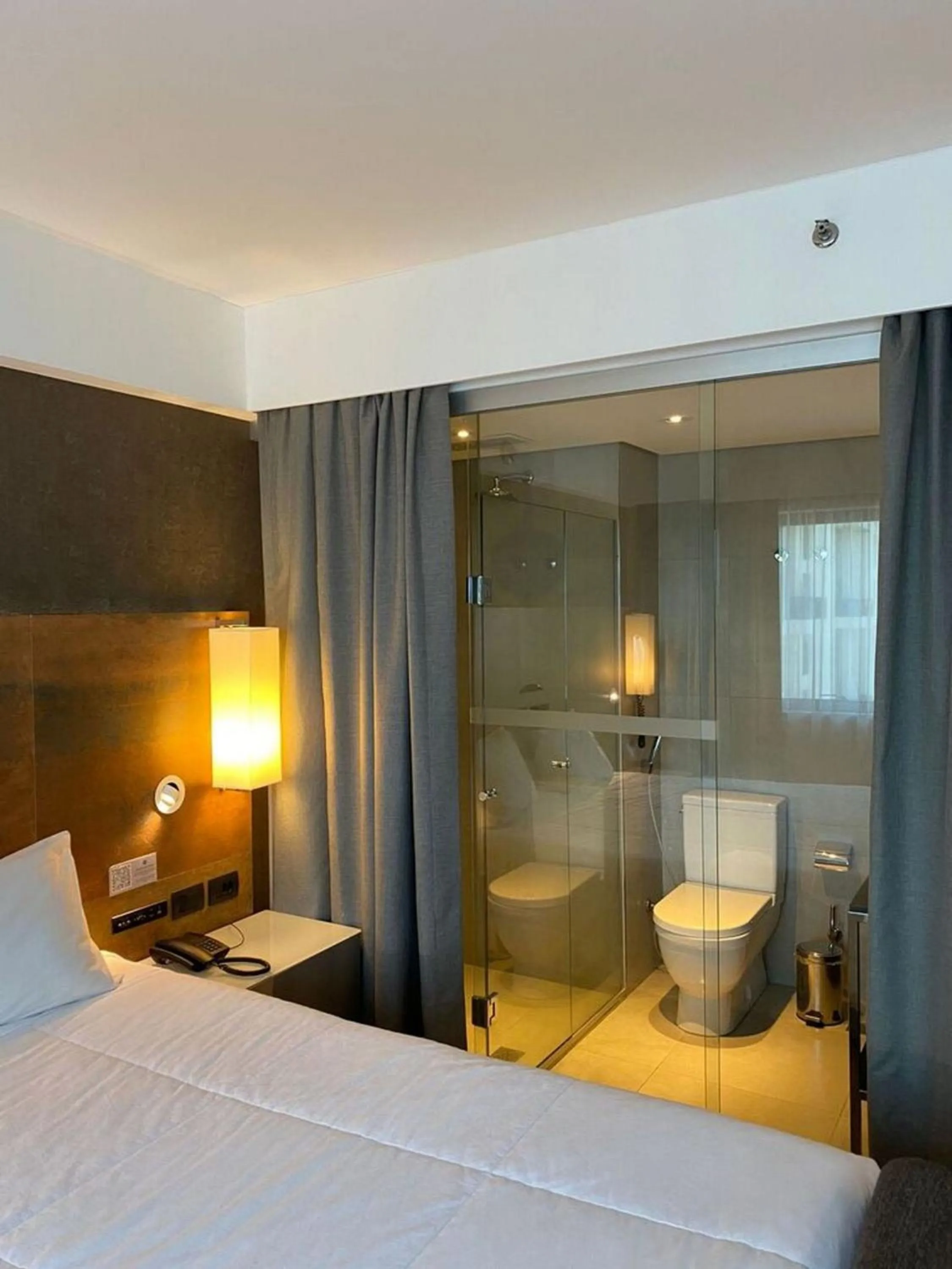 View (from property/room), Bed in ELEGANCE SUÍTES IBIRAPUERA