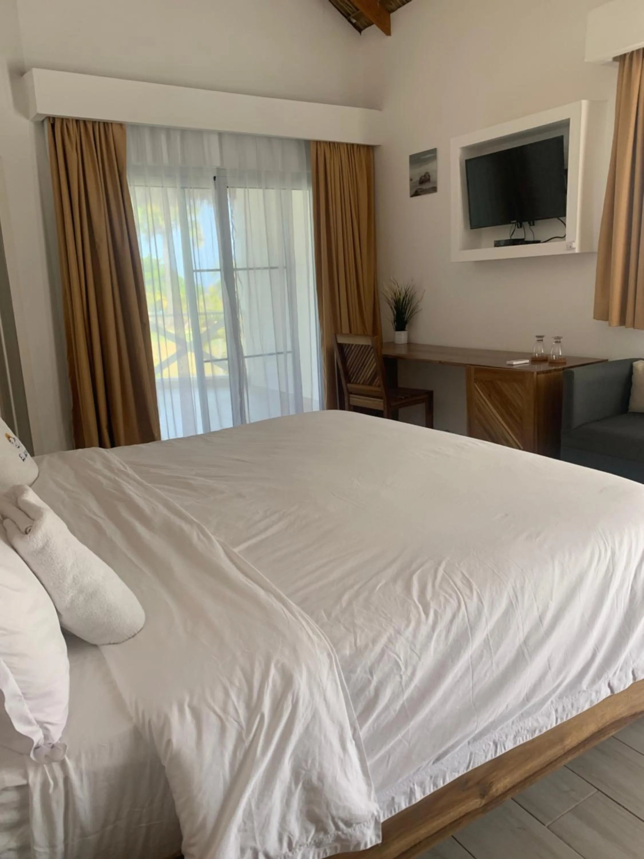 Bed in Hotel El Quemaito - Luxury Oceanfront Retreat