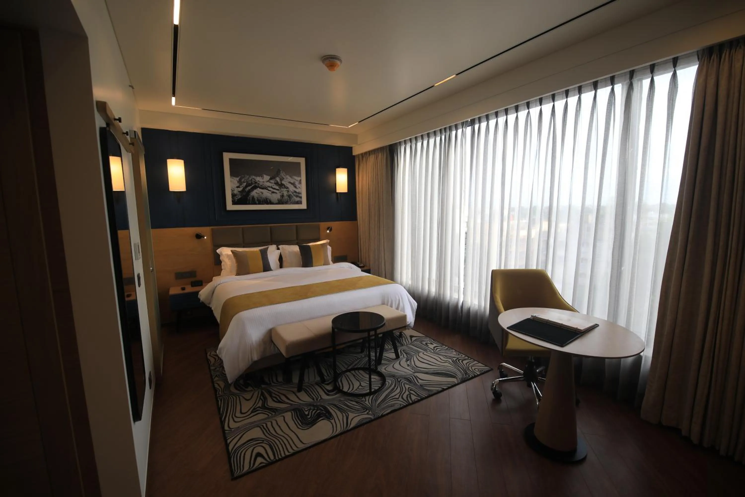 Photo of the whole room, Bed in Ramada Encore by Wyndham Siliguri Sevoke Road