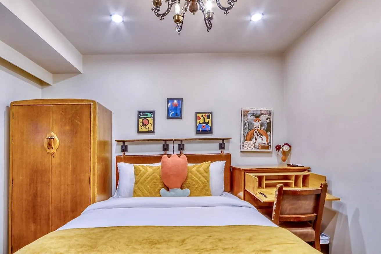 Bed in Neocolonial Nouveau Kensington Vacation Home