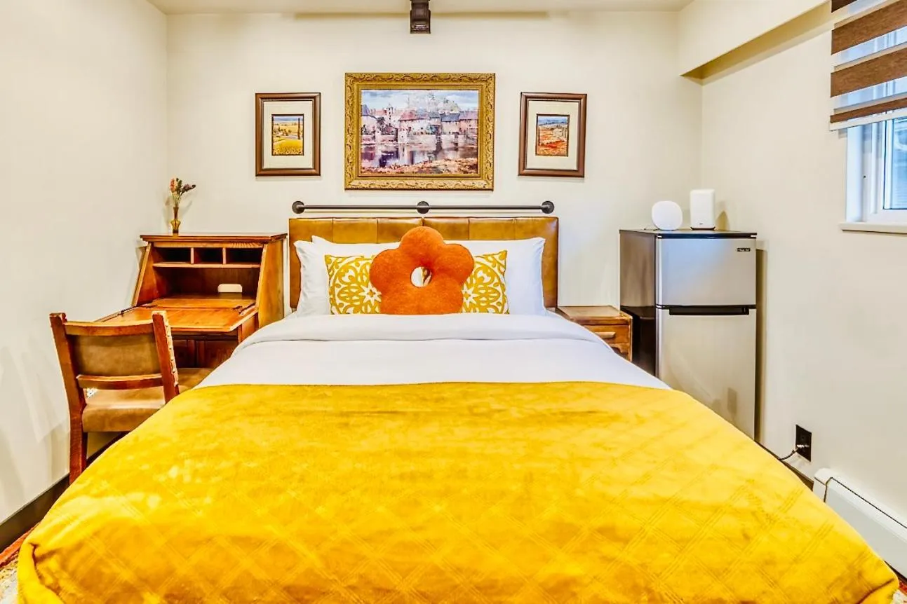 Bed in Neocolonial Nouveau Kensington Vacation Home