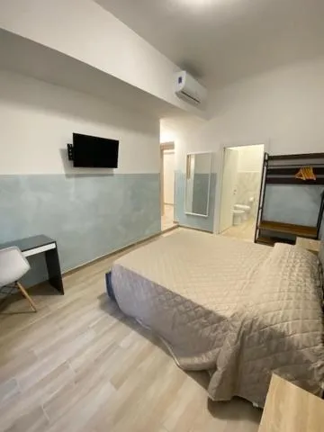 Kitchen or kitchenette, Bed in Cinemovie Guesthouse