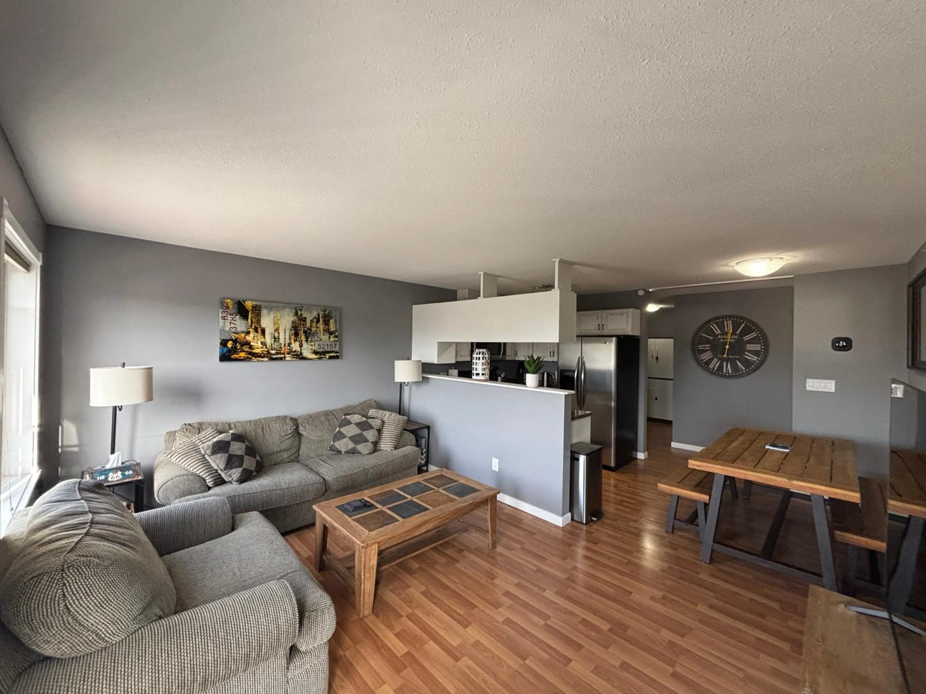 Living room in Top Floor Riverfront Condo with Stellar Sunsets!