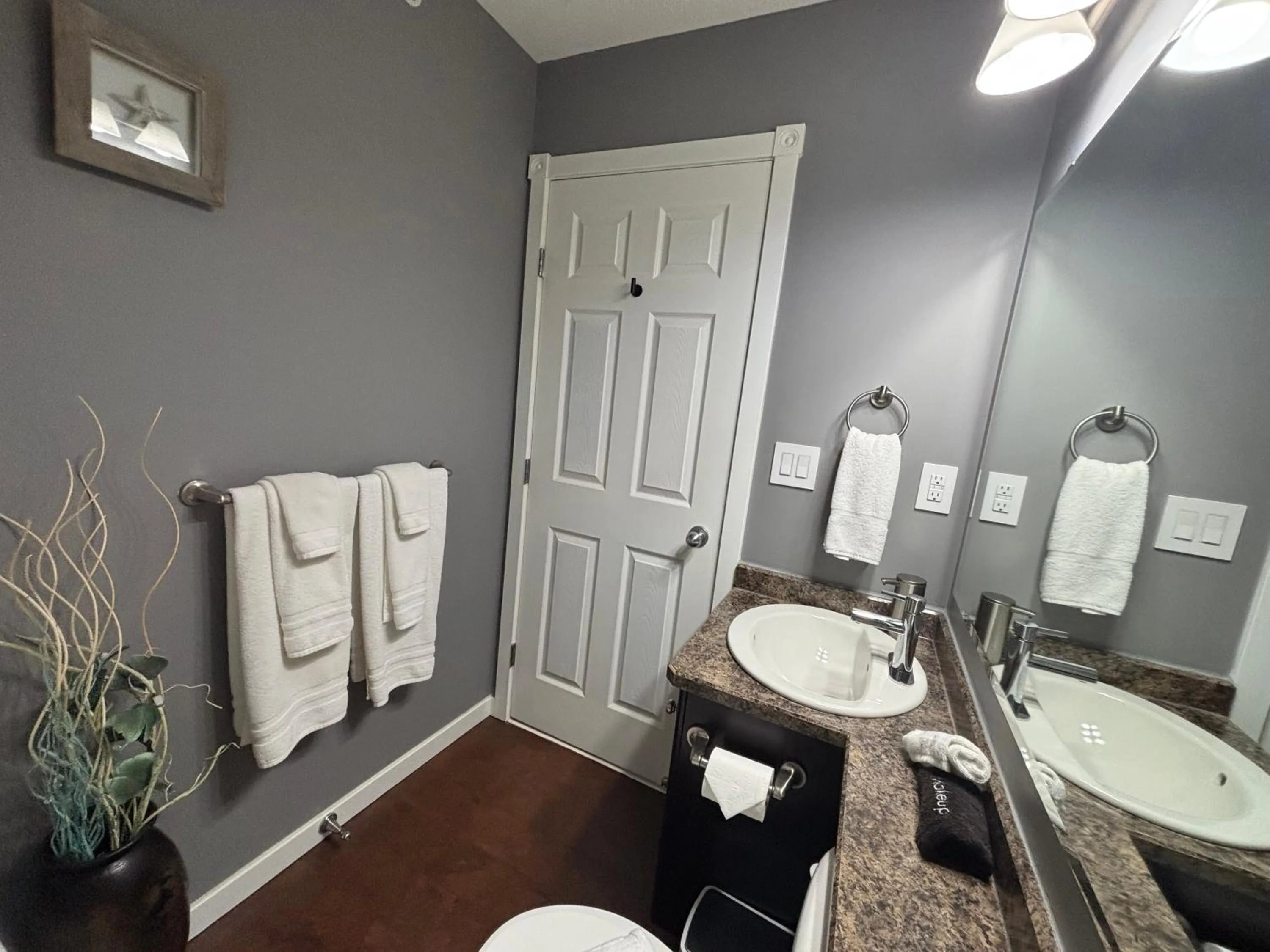 Bathroom in Top Floor Riverfront Condo with Stellar Sunsets!
