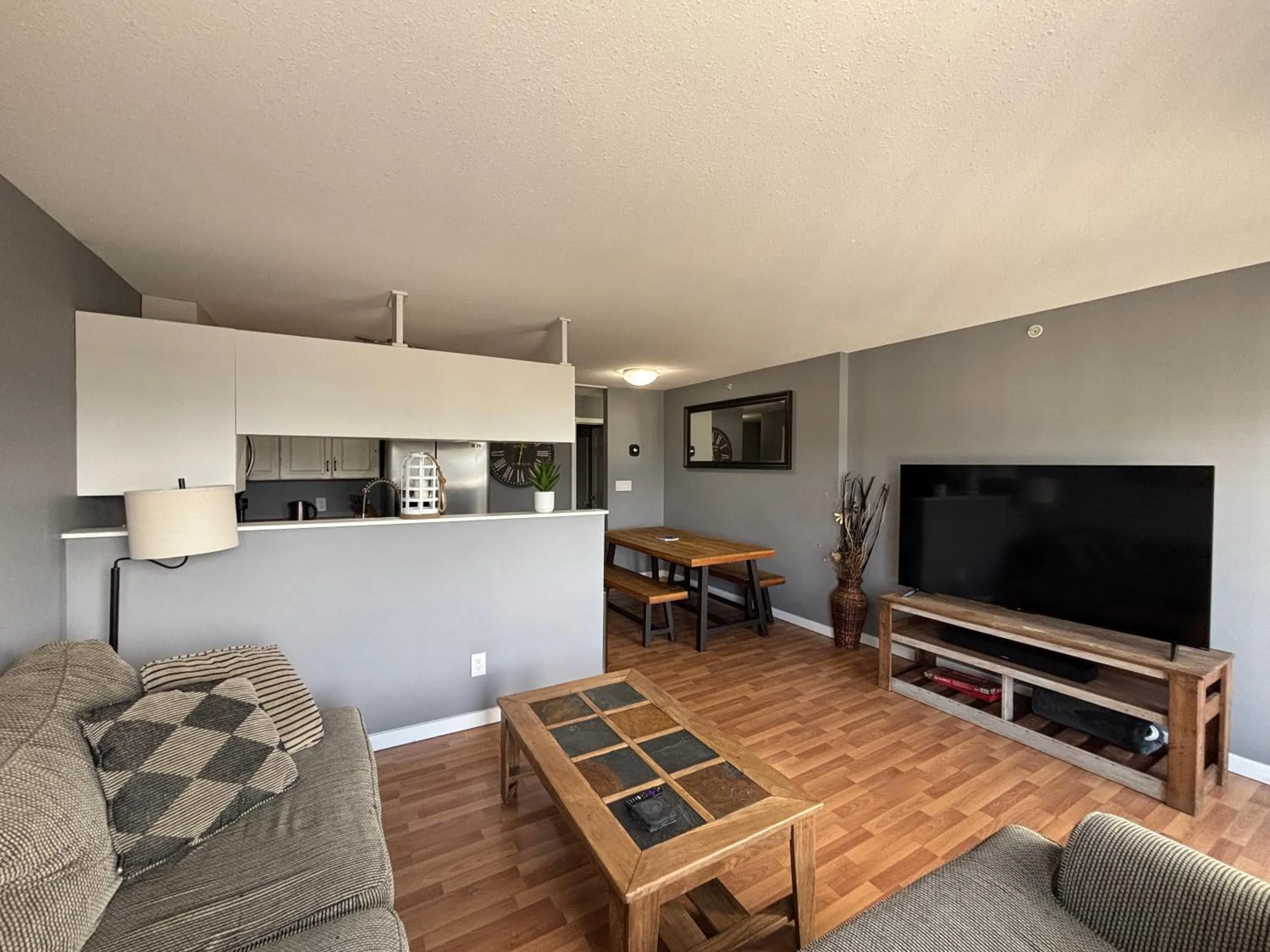 Living room in Top Floor Riverfront Condo with Stellar Sunsets!