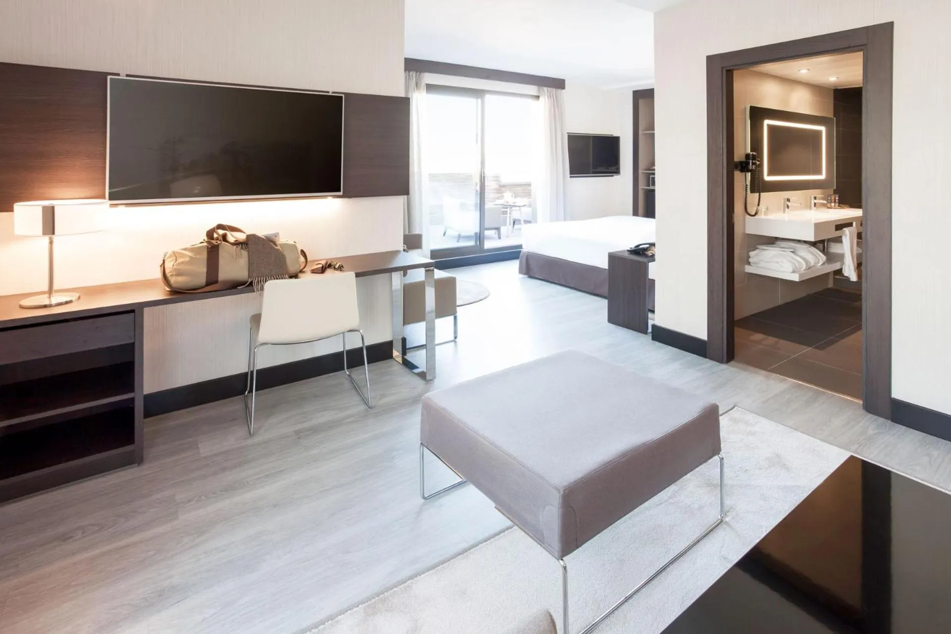 Living room, Bed in Novotel Madrid Center