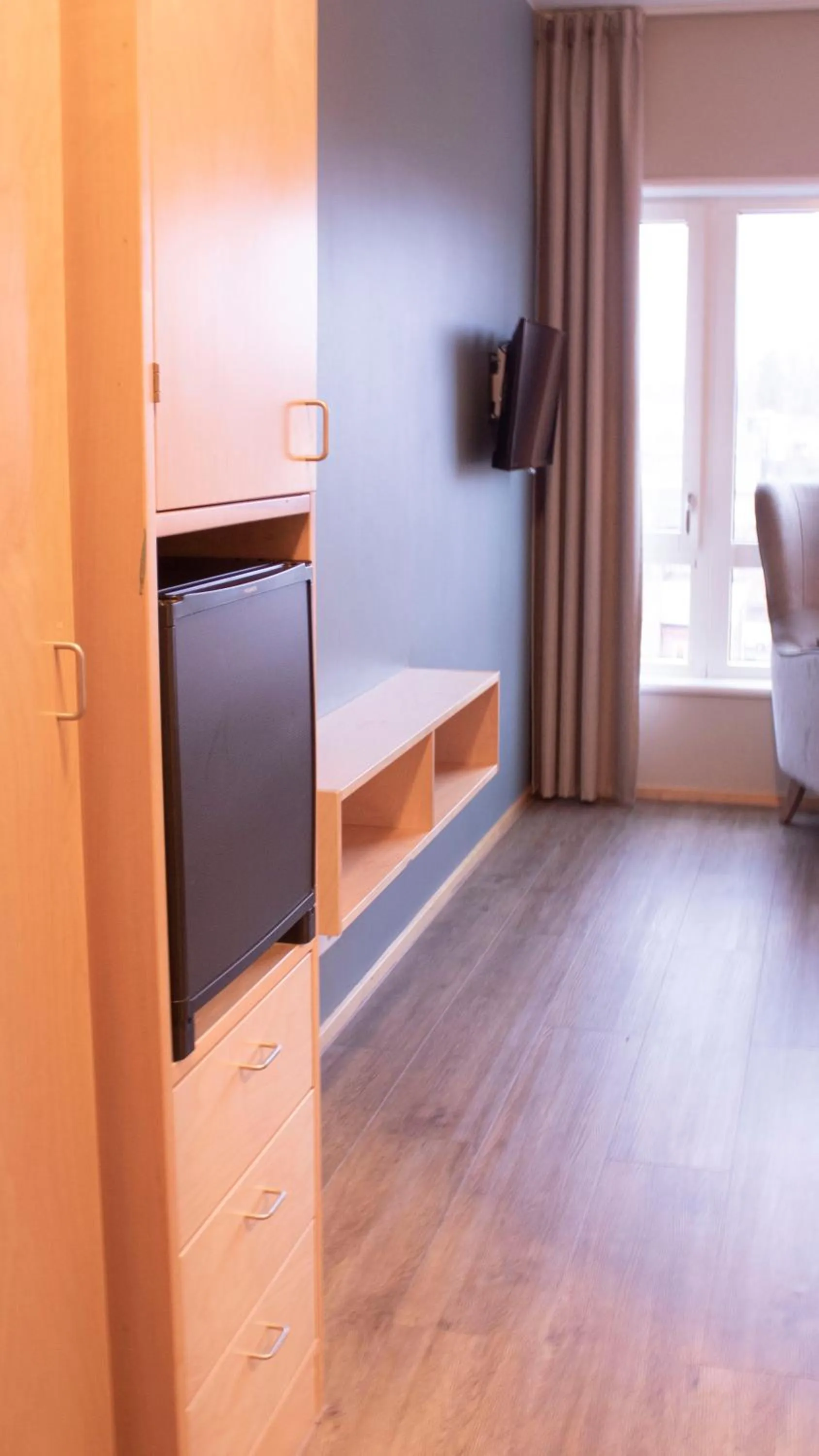 Communal lounge/ TV room in Ullevål Hotel