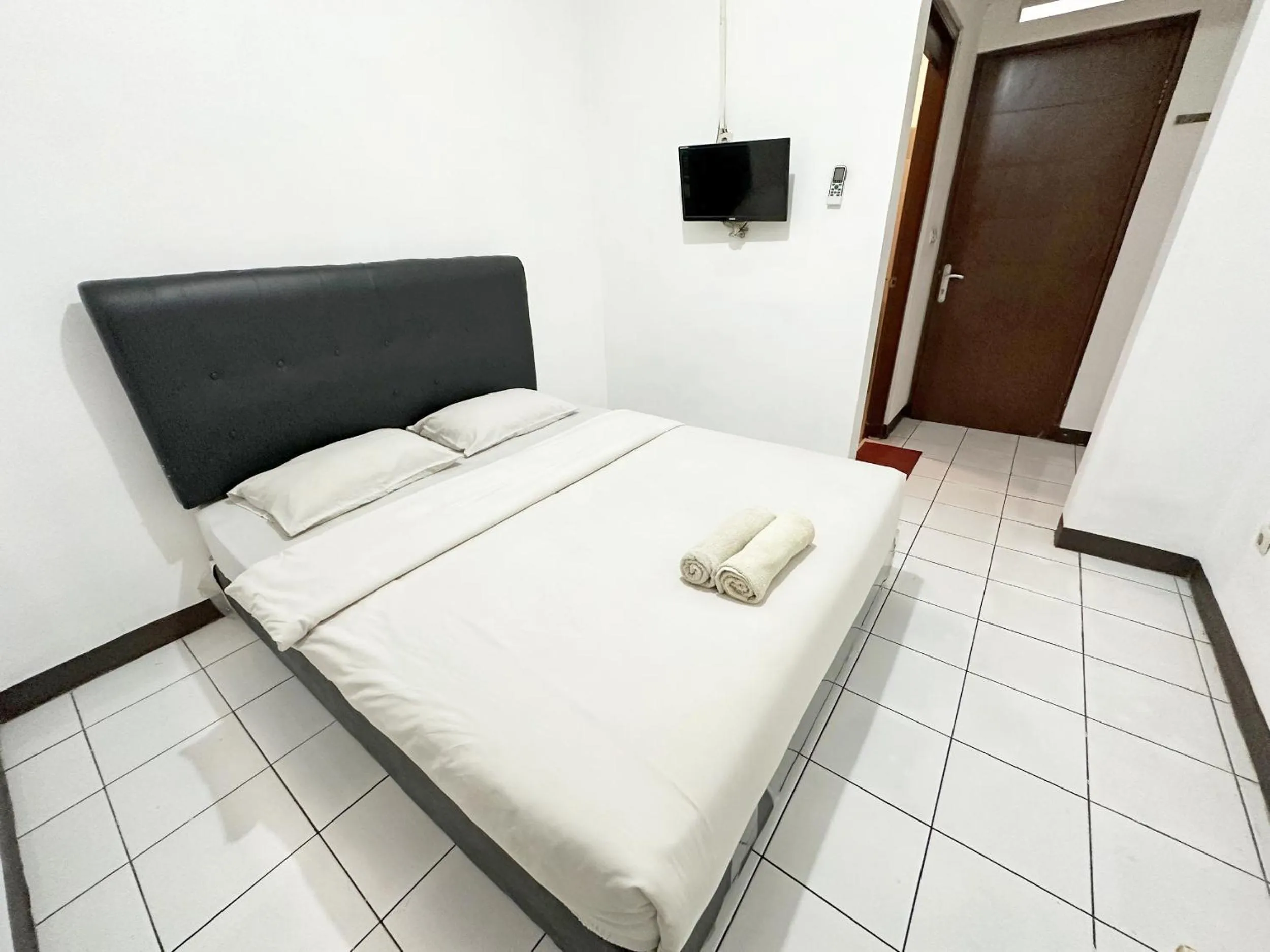 Bed in OYO 1608 Feby Maisonatte