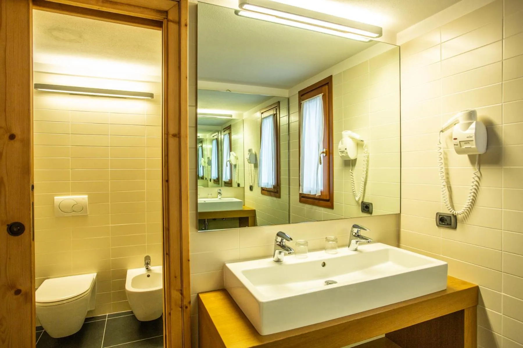 Bedroom in Sertorelli Sporthotel