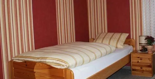 Photo of the whole room, Bed in Gasthaus Pension Schumbert