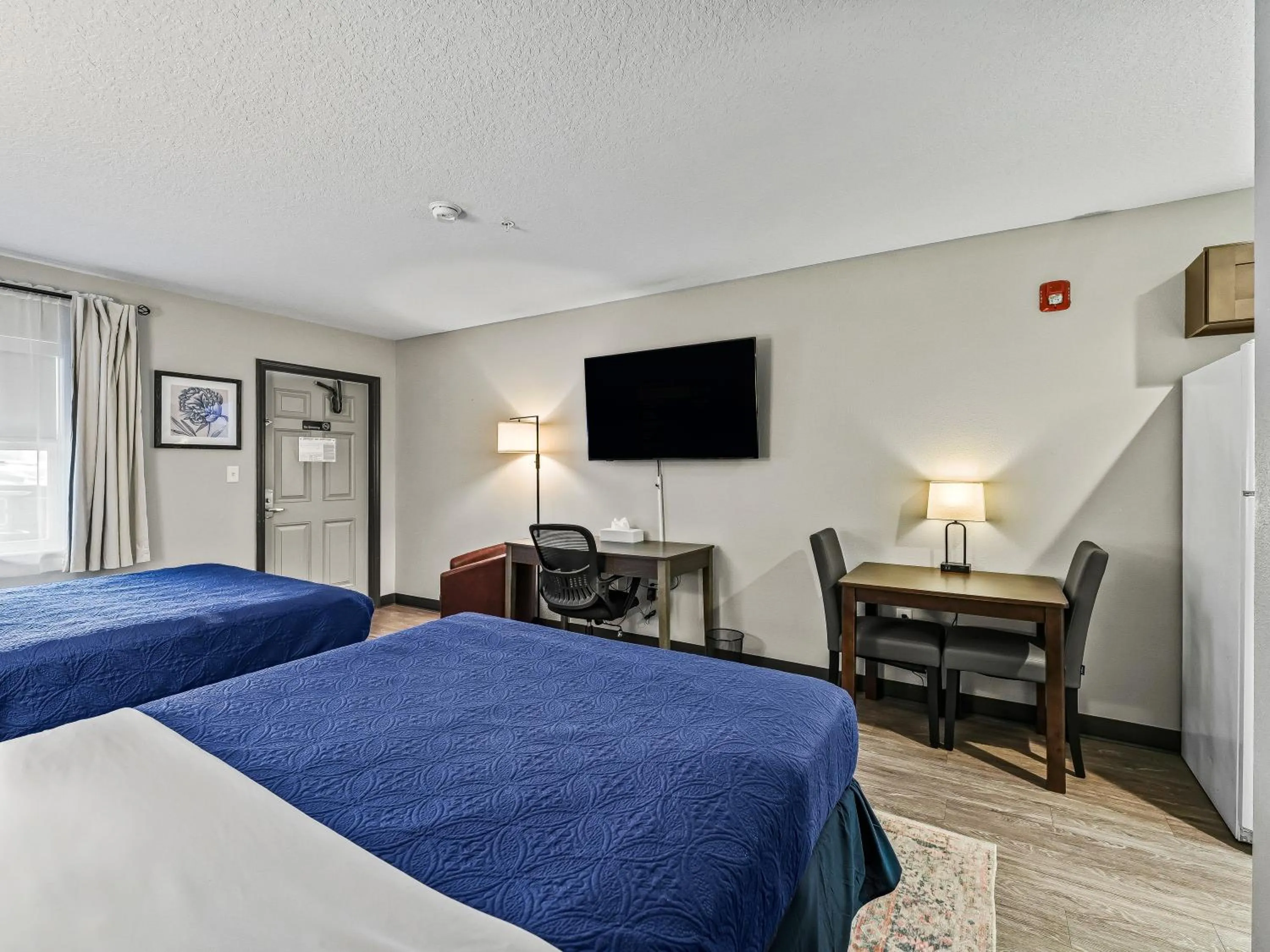 Bed in Baymont by Wyndham Ocala Suites
