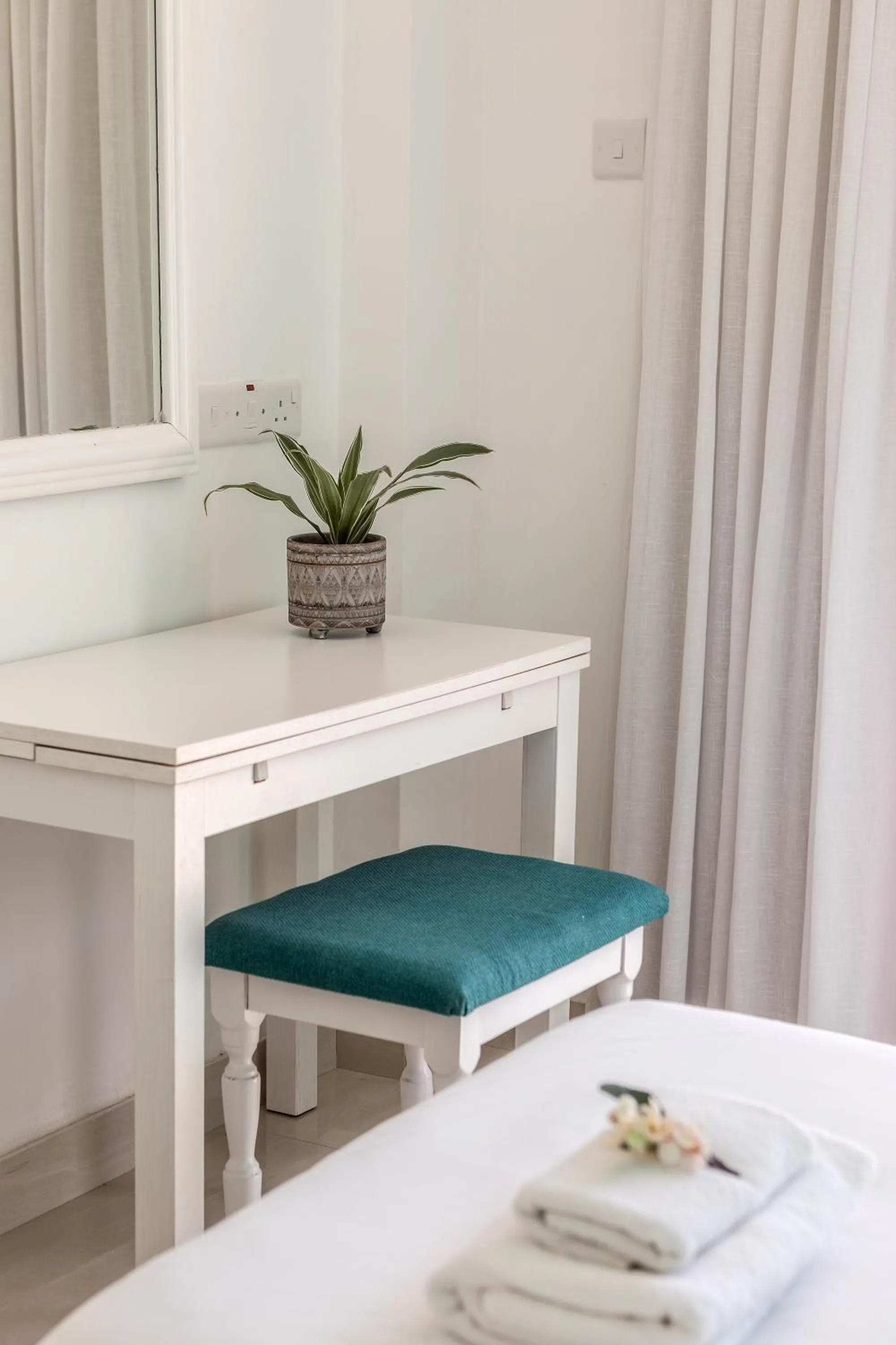 Bed in Mia Hotel Apartment