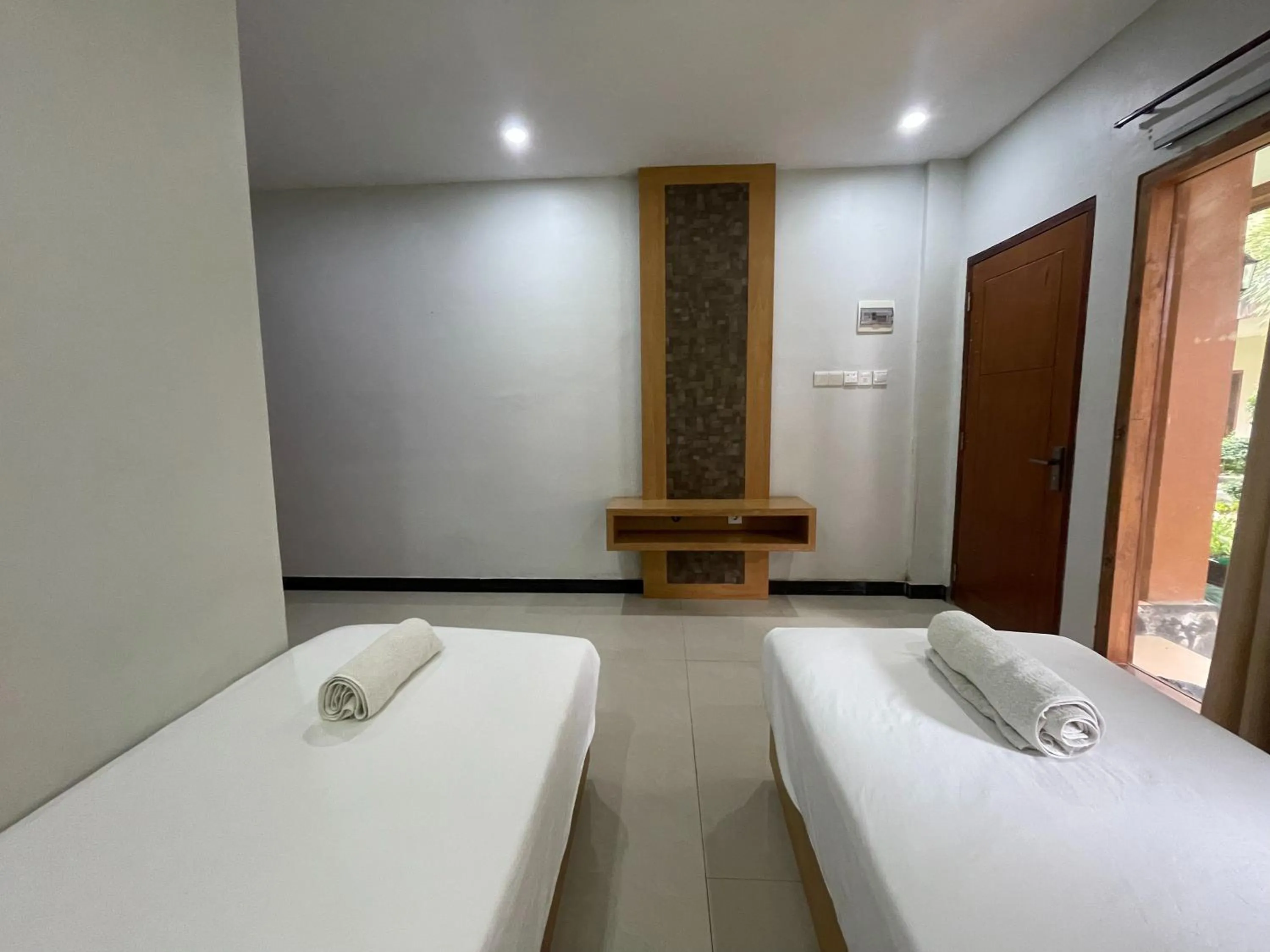 Bed in Melati Resort & Hotel Kuta Lombok