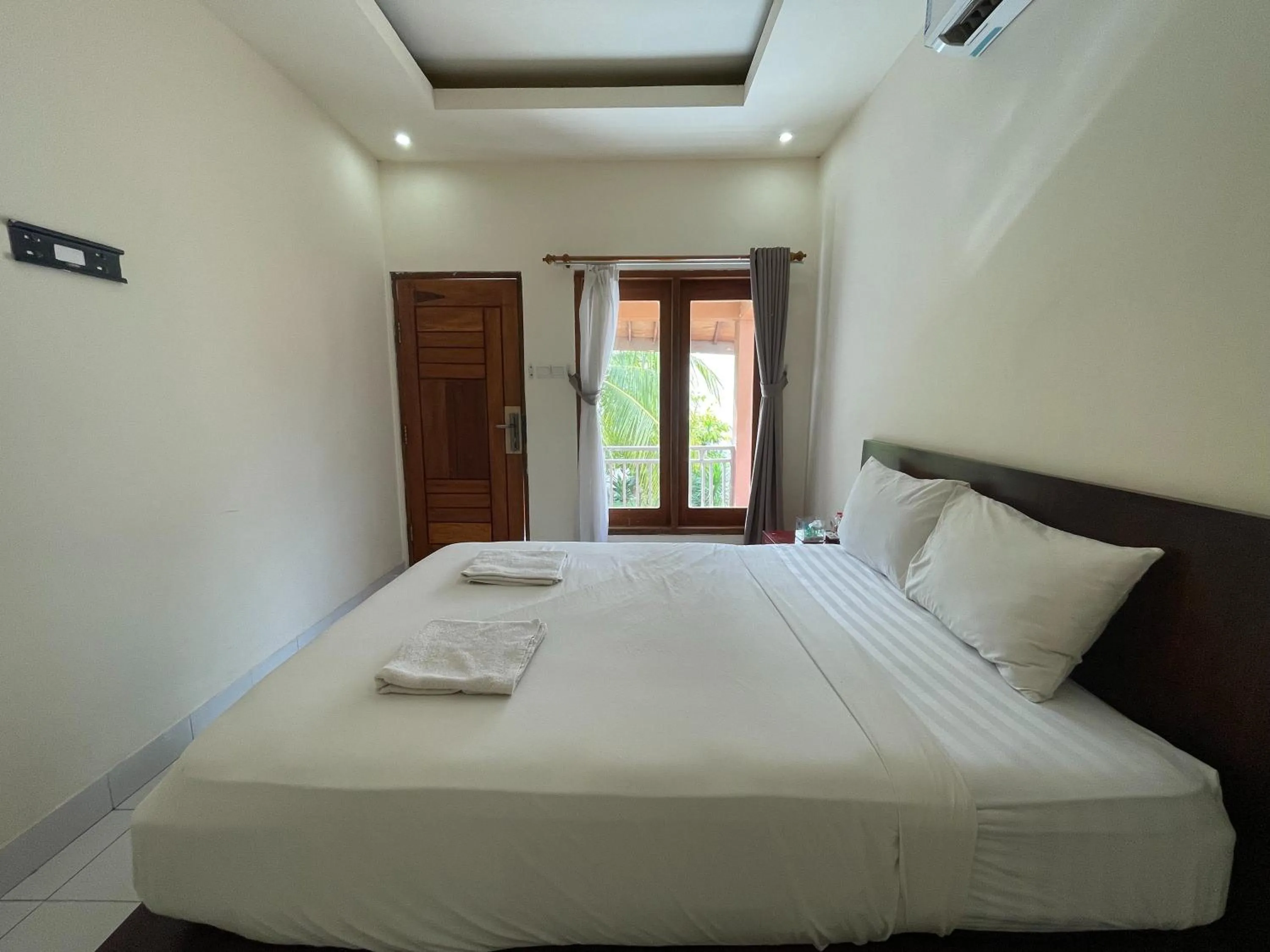 Bed in Melati Resort & Hotel Kuta Lombok