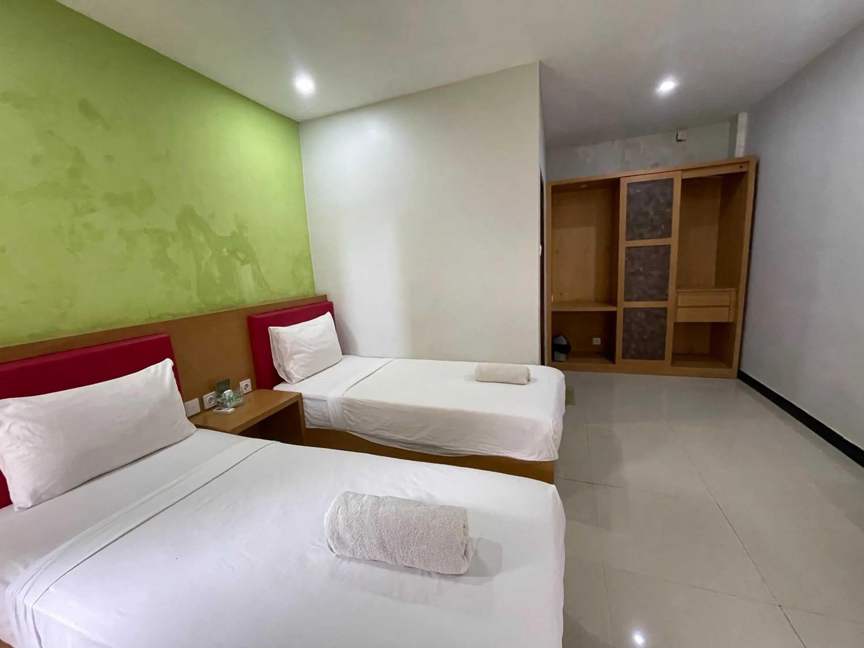 Bed in Melati Resort & Hotel Kuta Lombok