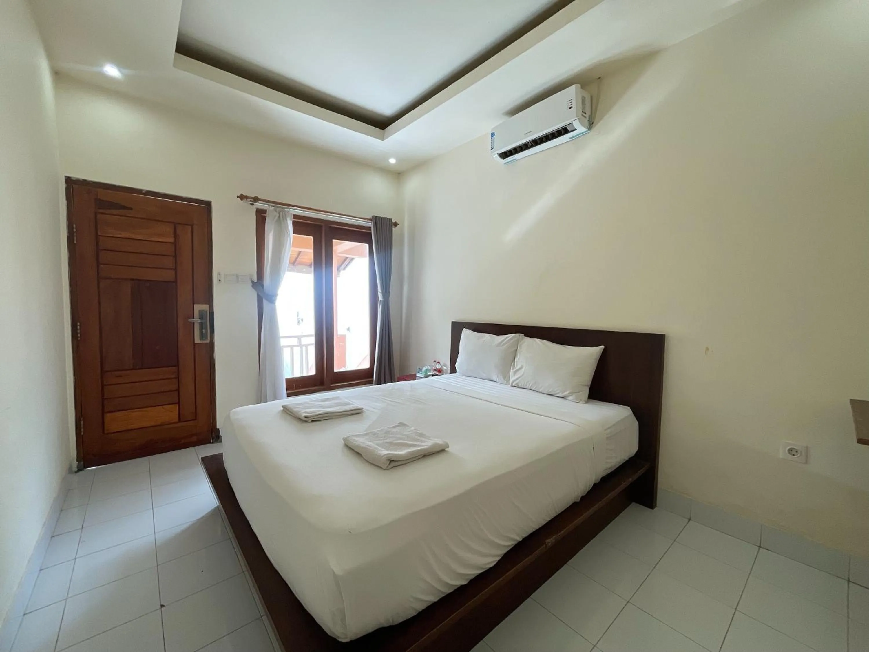 Bed in Melati Resort & Hotel Kuta Lombok