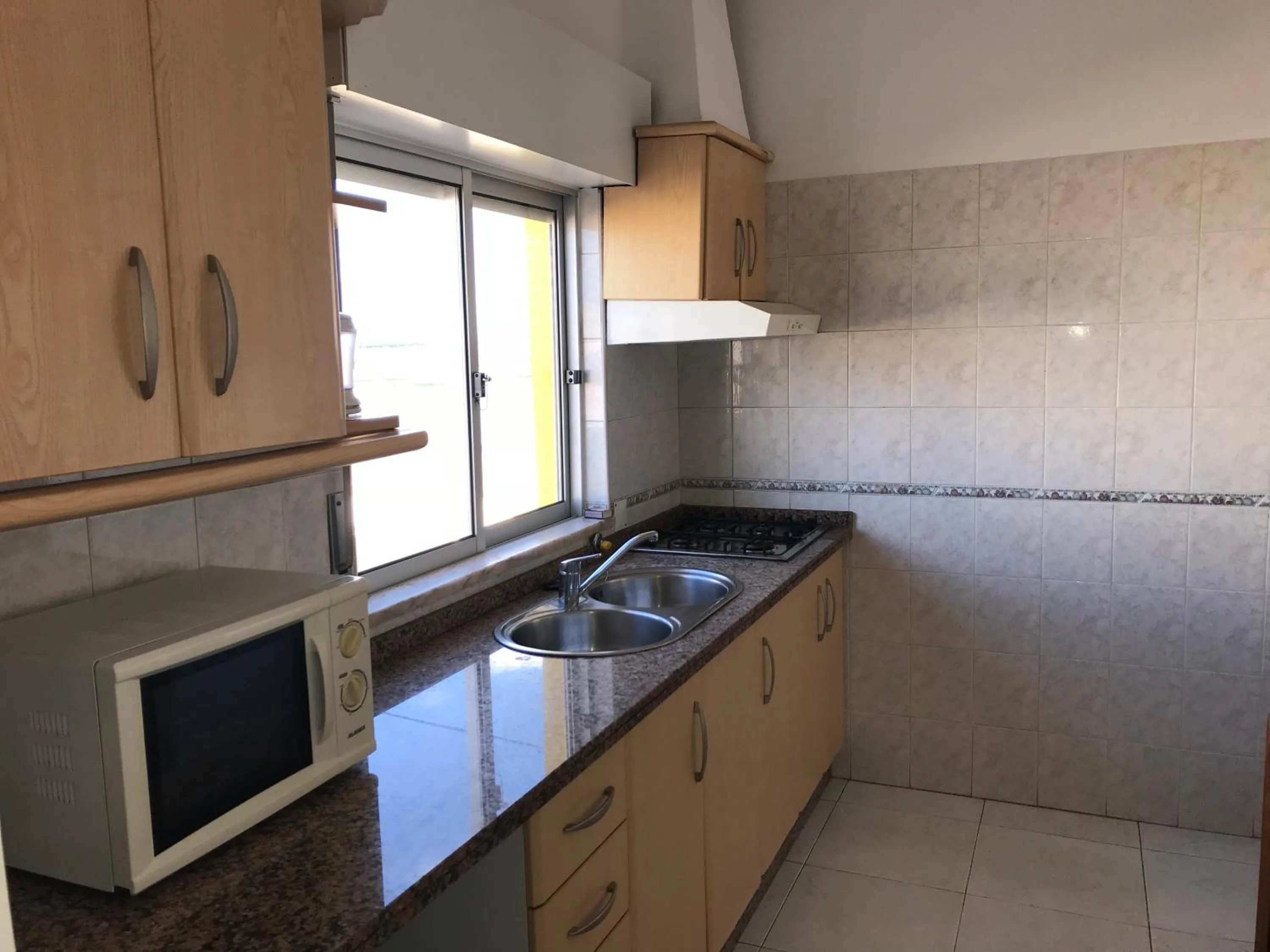 Kitchen or kitchenette in Apartamentos Barracuda