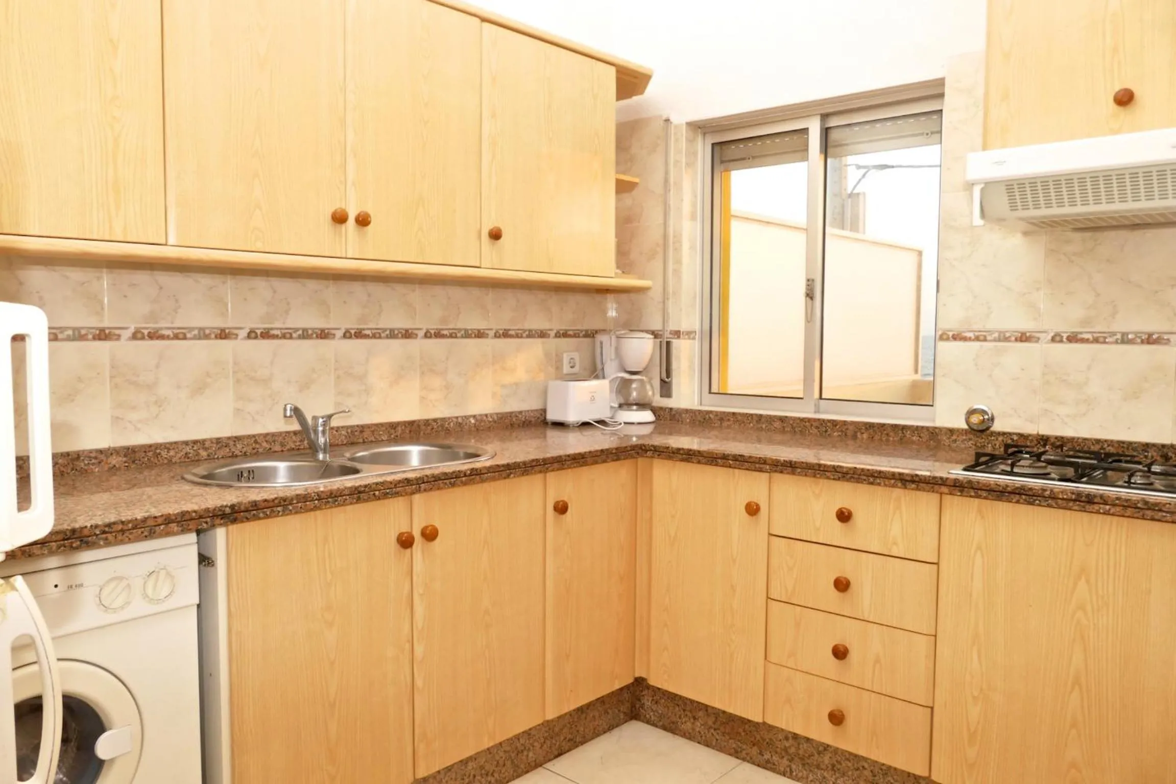 Kitchen or kitchenette in Apartamentos Barracuda
