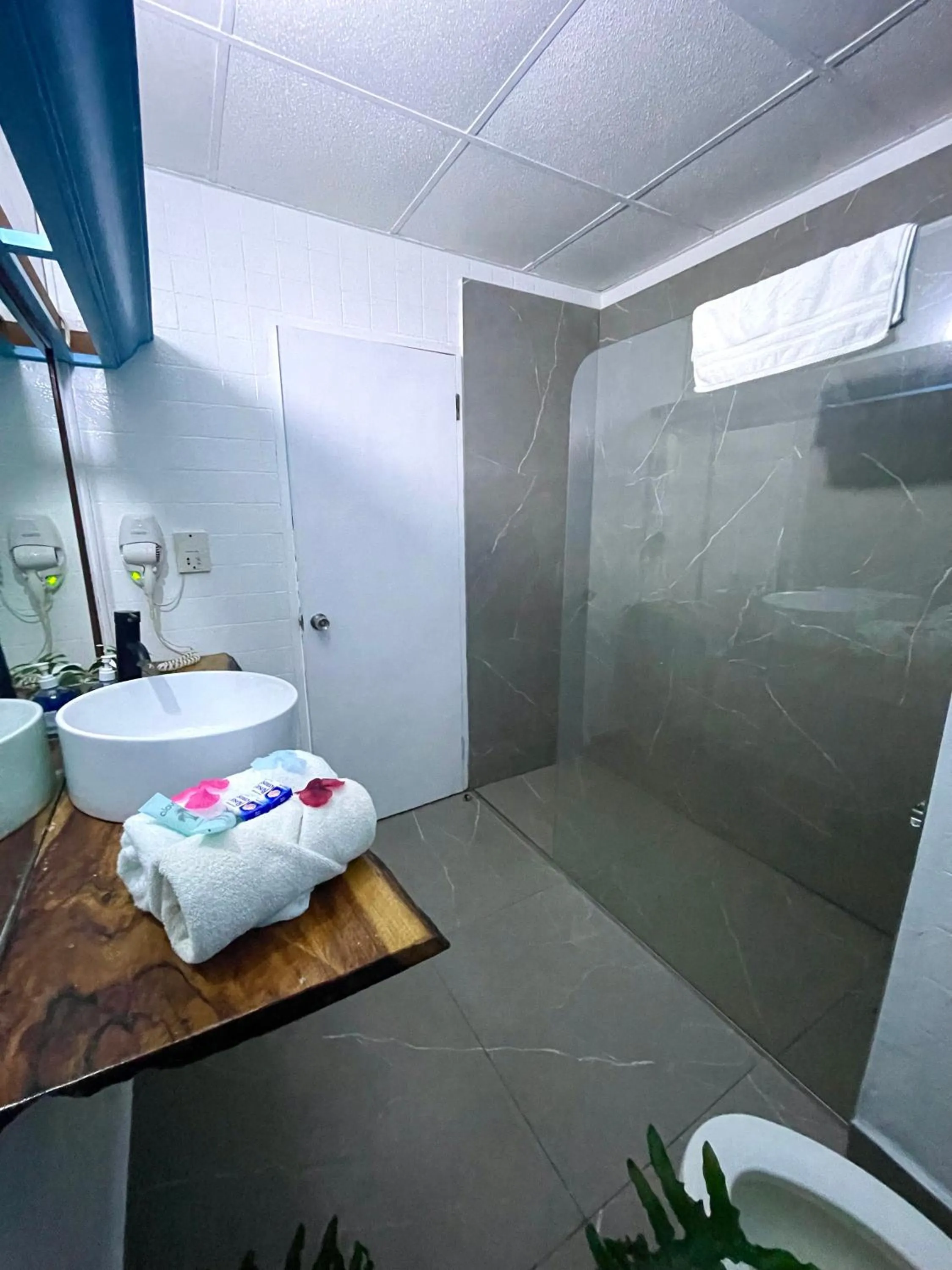 Shower in Sand and Tan Beach Hotel