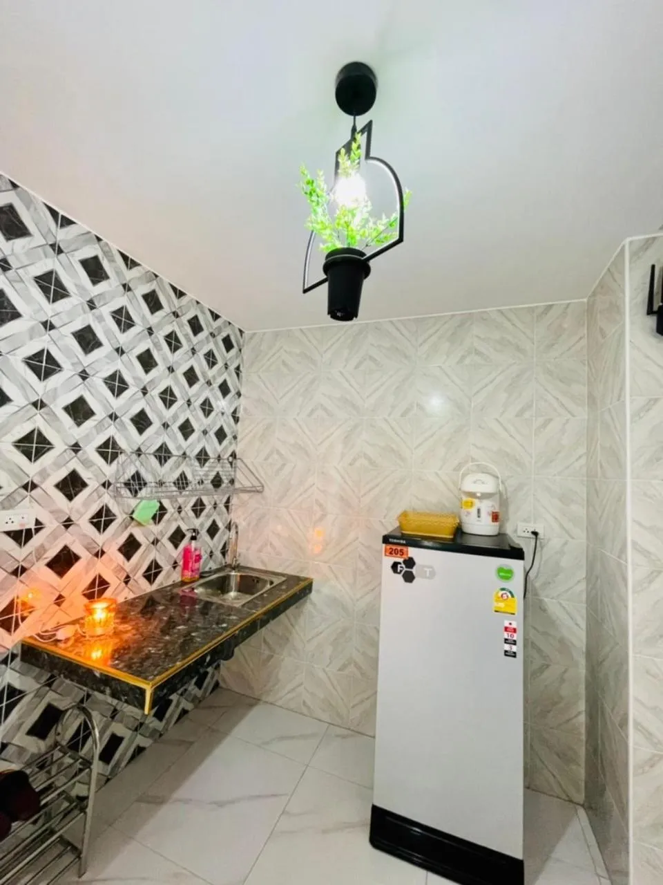 Kitchen or kitchenette in โรงแรมเรือนคุณเล็ก กานต์สินี