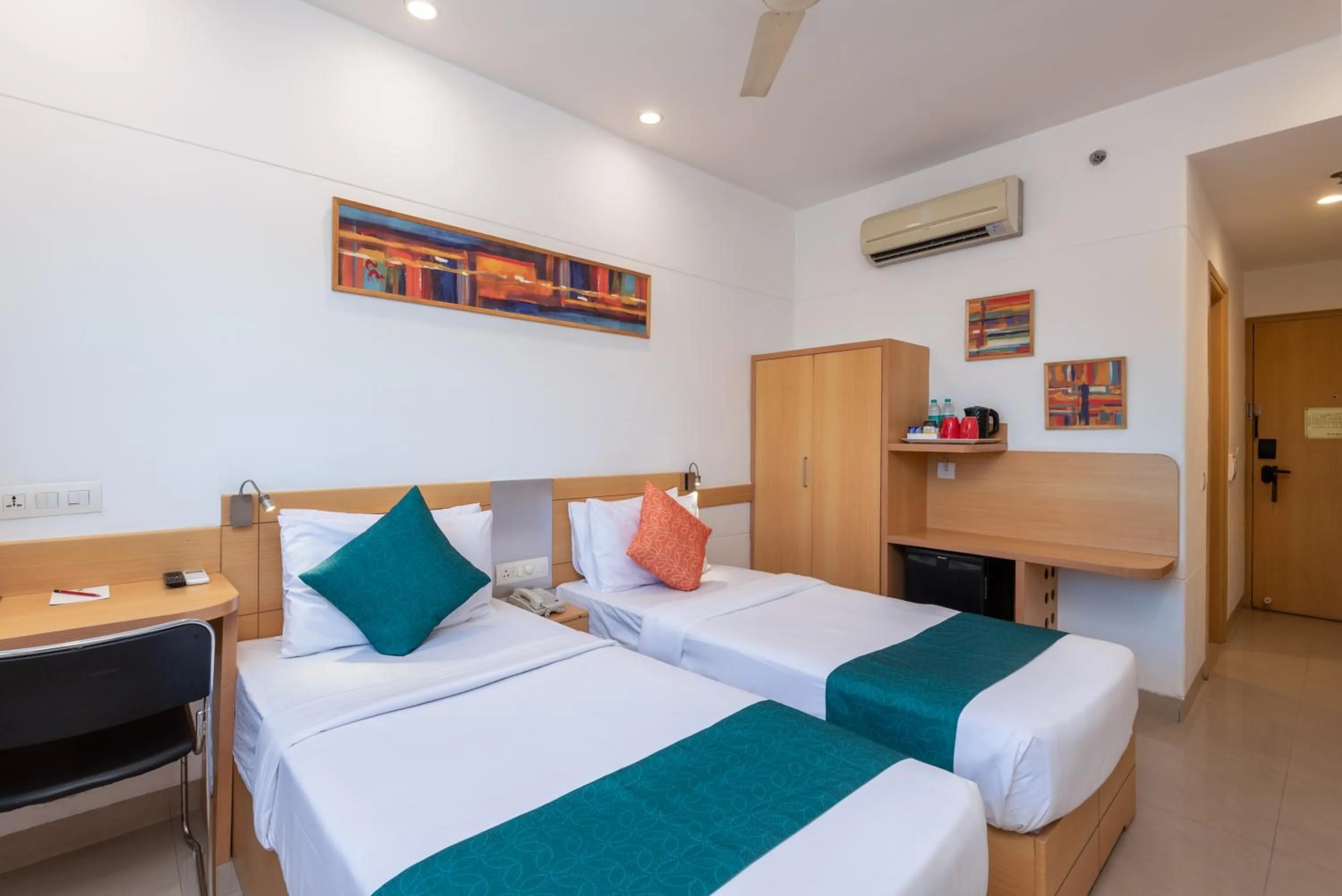 Bed in Mango Grove Hotel