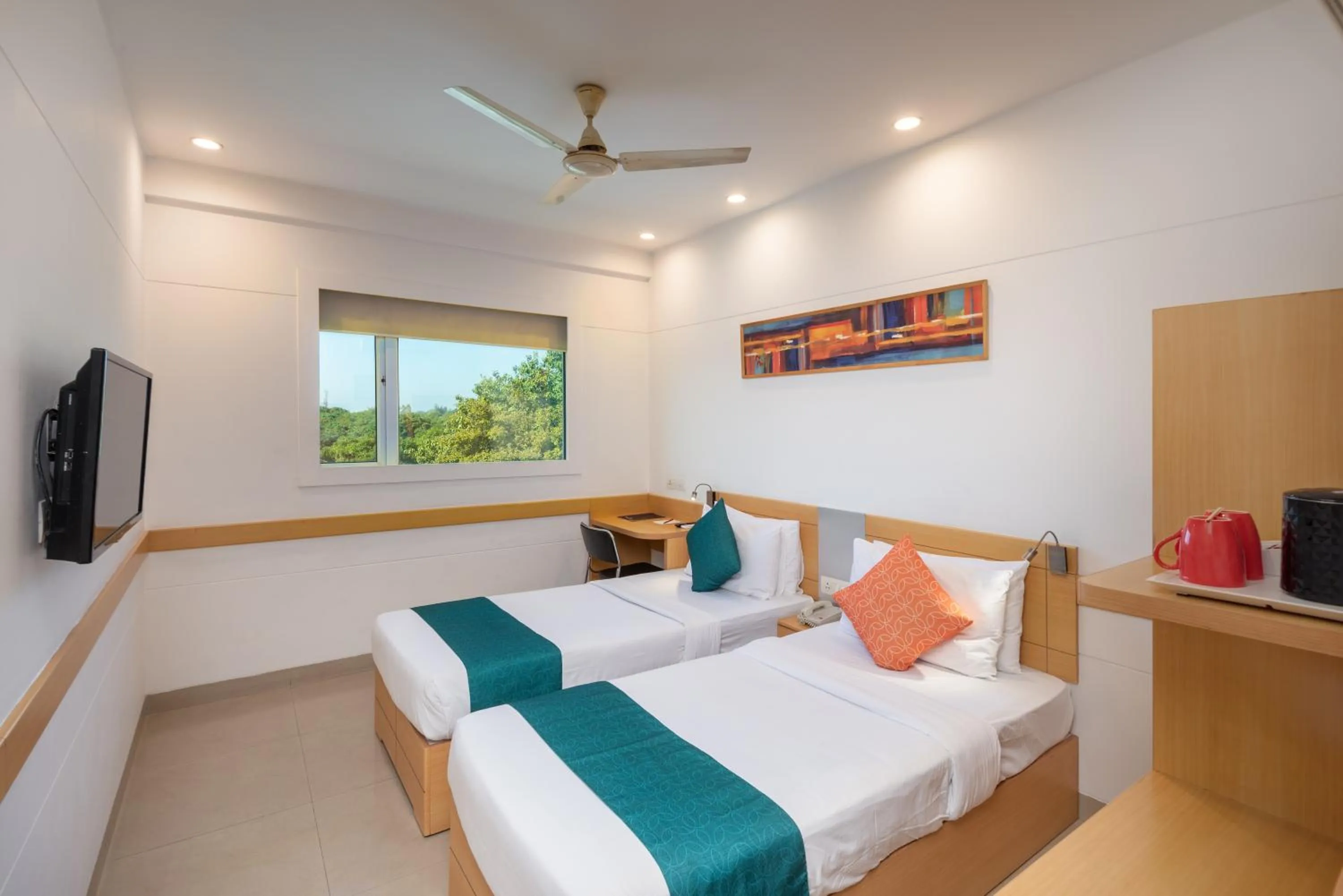 Bed in Mango Grove Hotel