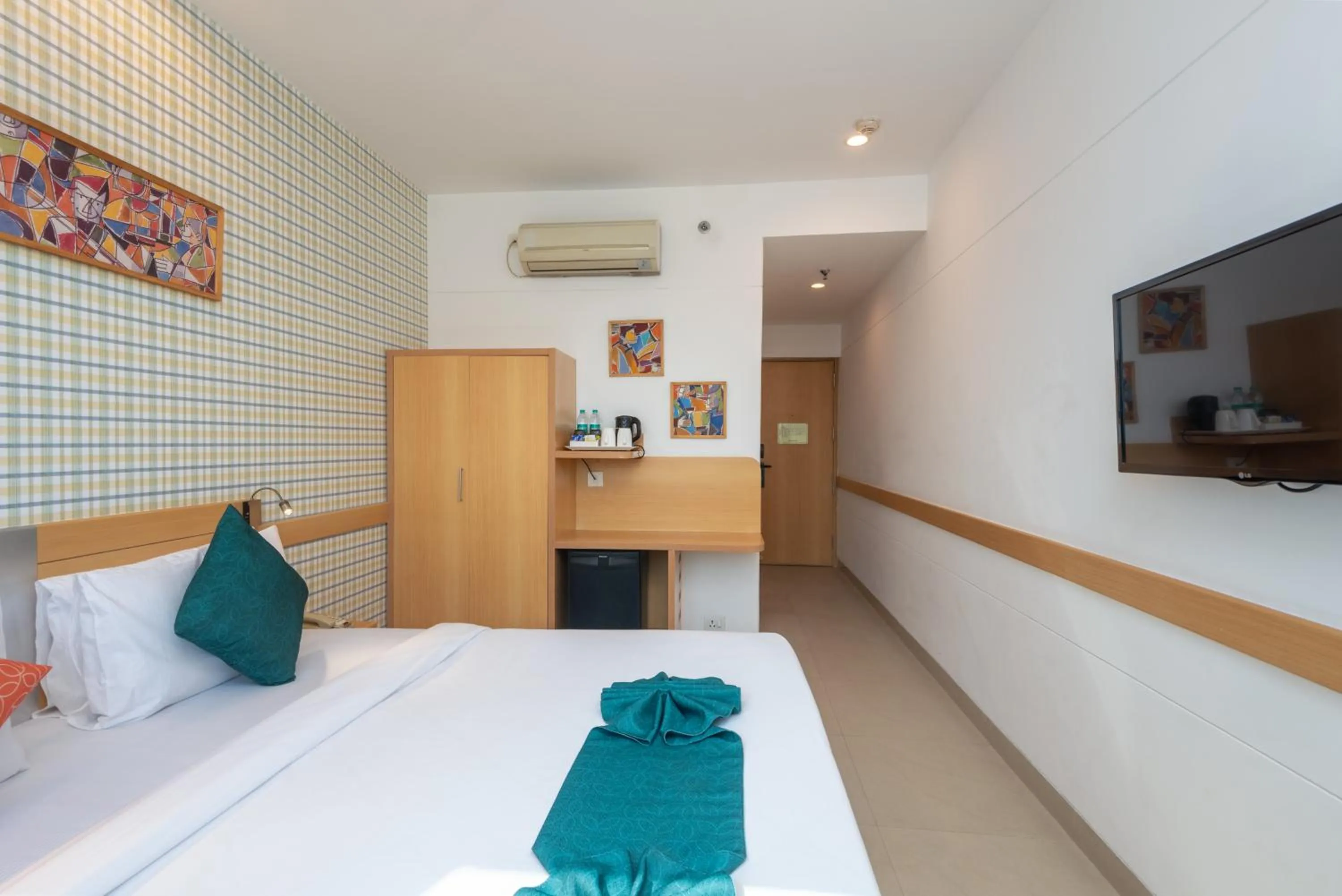 Bed in Mango Grove Hotel