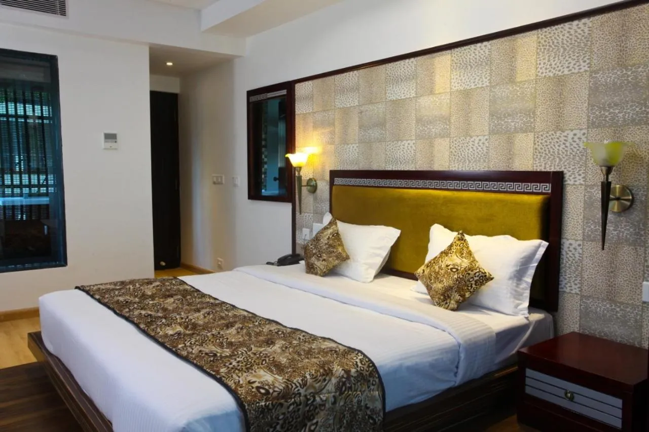 Bed in Hotel Tigers Roare Thekkady