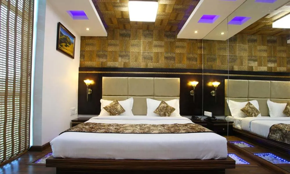 Bed in Hotel Tigers Roare Thekkady