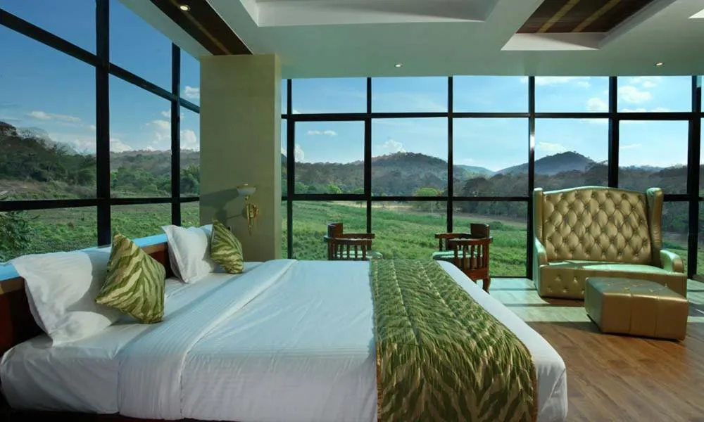 Bed in Hotel Tigers Roare Thekkady