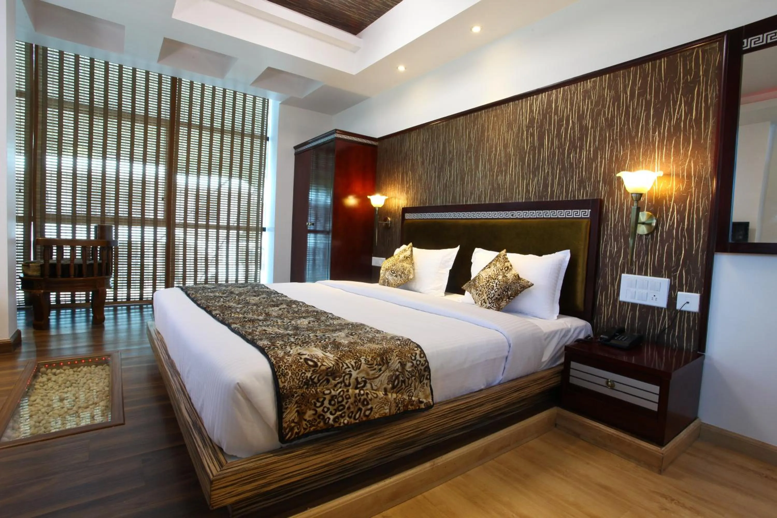 Bed in Hotel Tigers Roare Thekkady